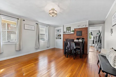 a view of a livingroom with furniture and wooden floor