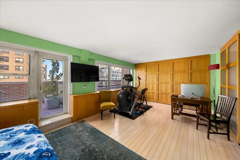 a view of a livingroom with workspace and a couch