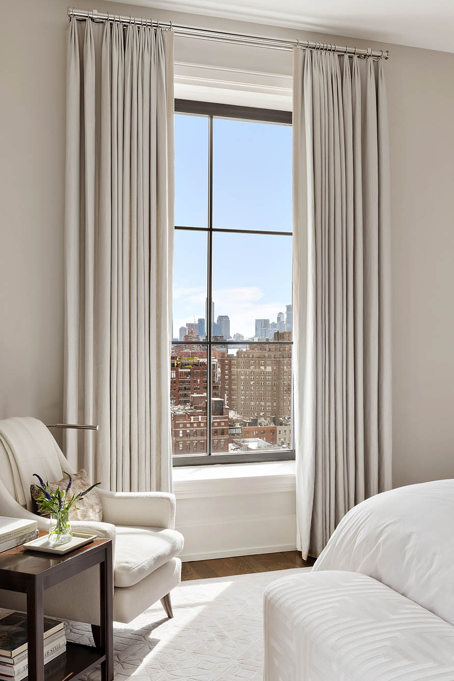212 West 18th Street, Unit 14A Manhattan, NY 10011 - Photo 13 of 17 a living room with furniture and a window