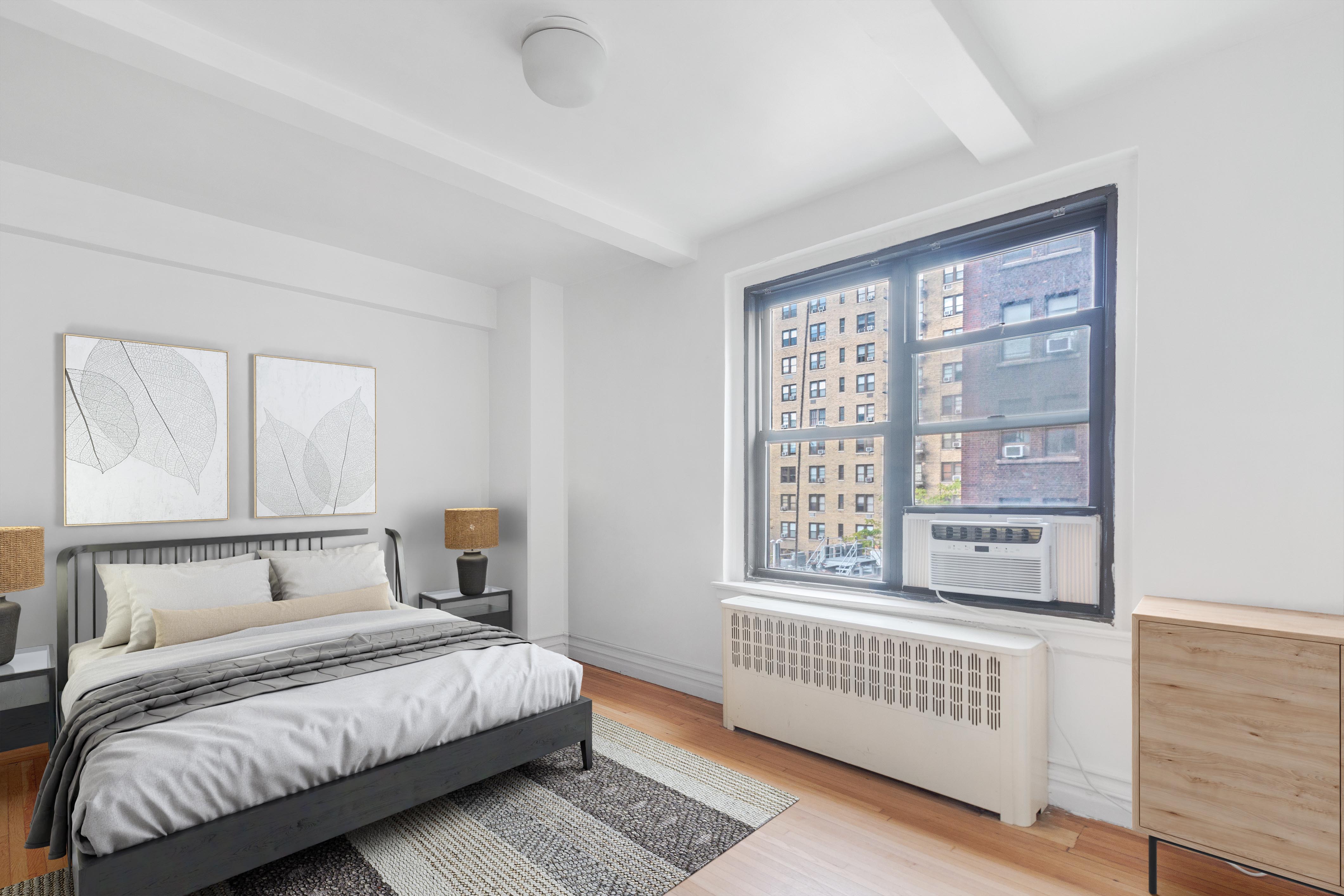 235 West End Avenue, Unit 8G Manhattan, NY 10023 - Photo 3 of 13 a bedroom with a bed and a window