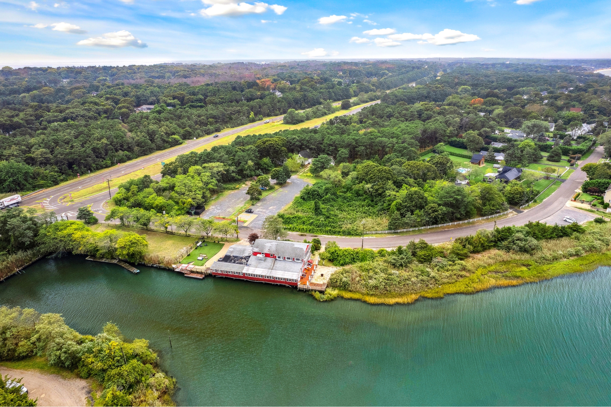 5 Inlet Road Hampton Bays, NY 11946 - Photo 20 of 20 an aerial view of a house with a lake view