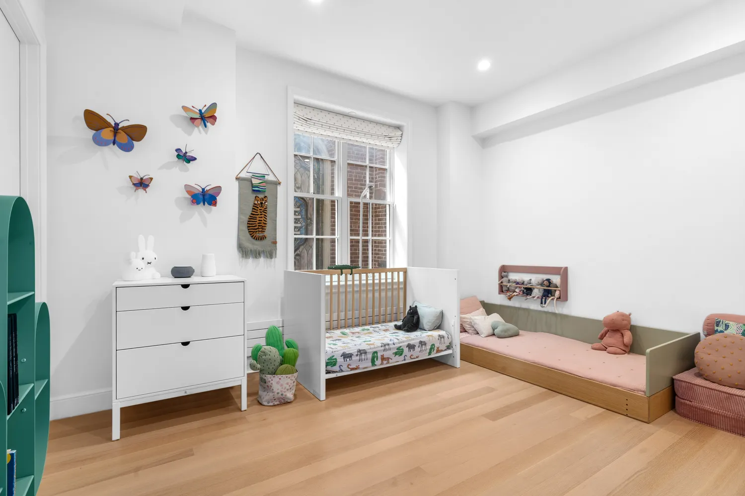 a bedroom with furniture and a wooden floor