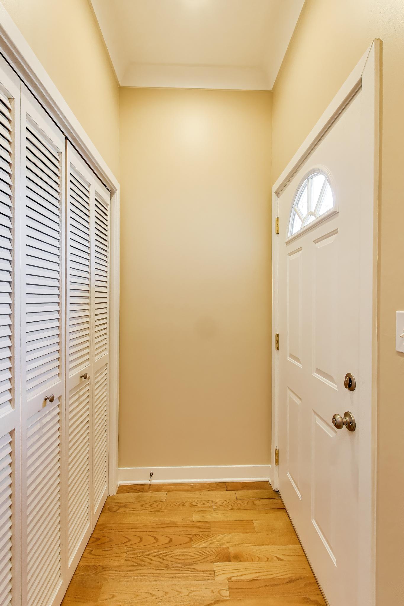 4845 North Springfield Avenue, Unit 2 Chicago, IL 60625 - Photo 28 of 32 a view of a livingroom with wooden floor and a bathroom