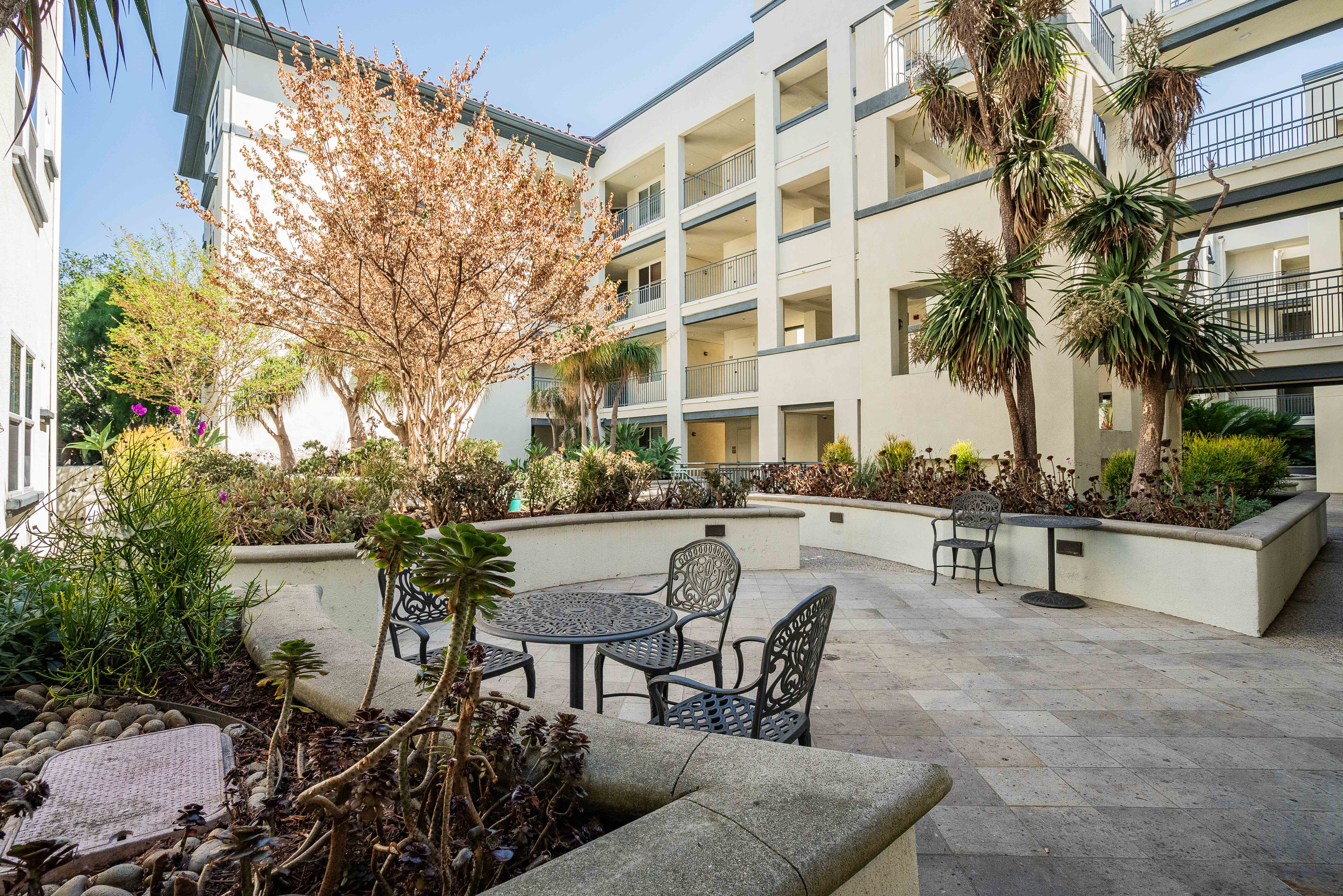 12963 West Runway Road Playa Vista, CA 90094 - Photo 18 of 39 a view of a patio with couches table and chairs and potted plants