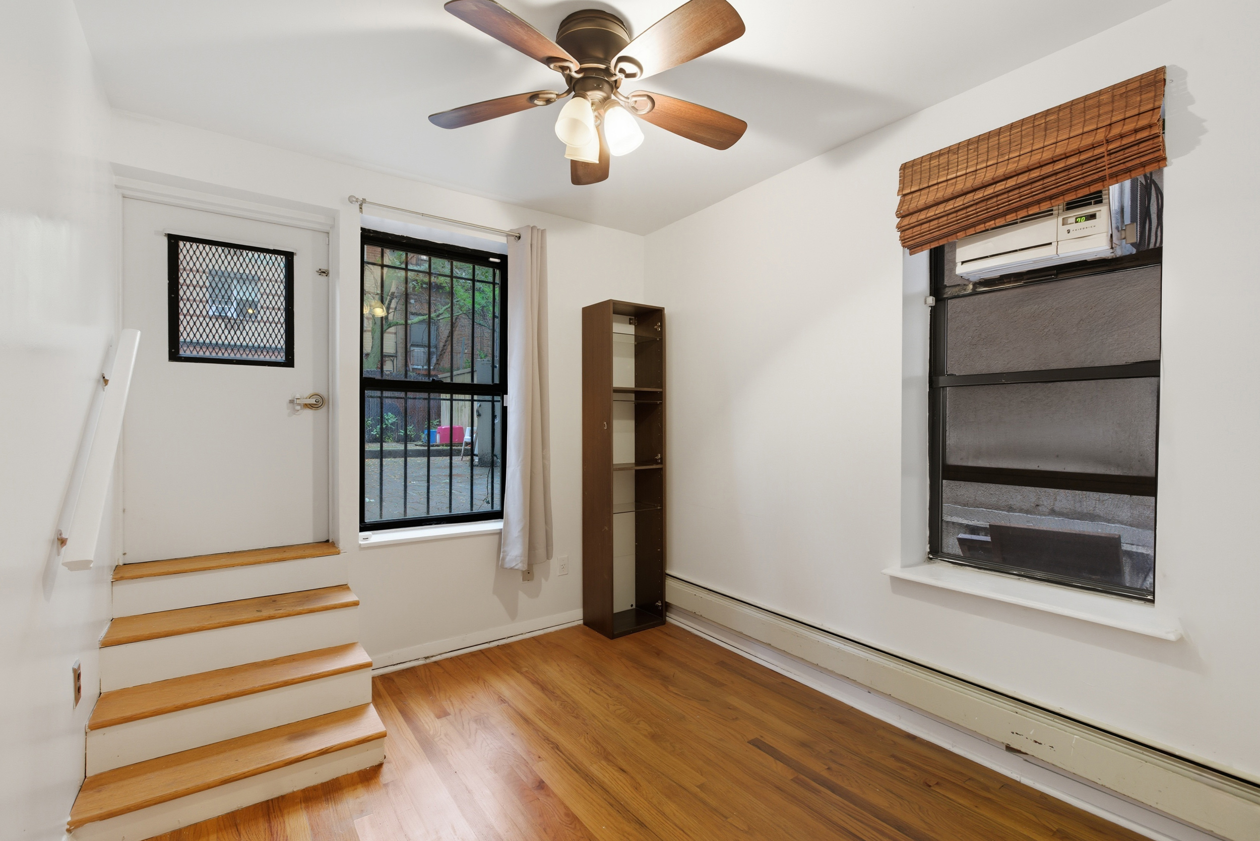 420 East 117th Street, Unit 1 Manhattan, NY 10035 - Photo 5 of 9 a view of an entryway with wooden floor