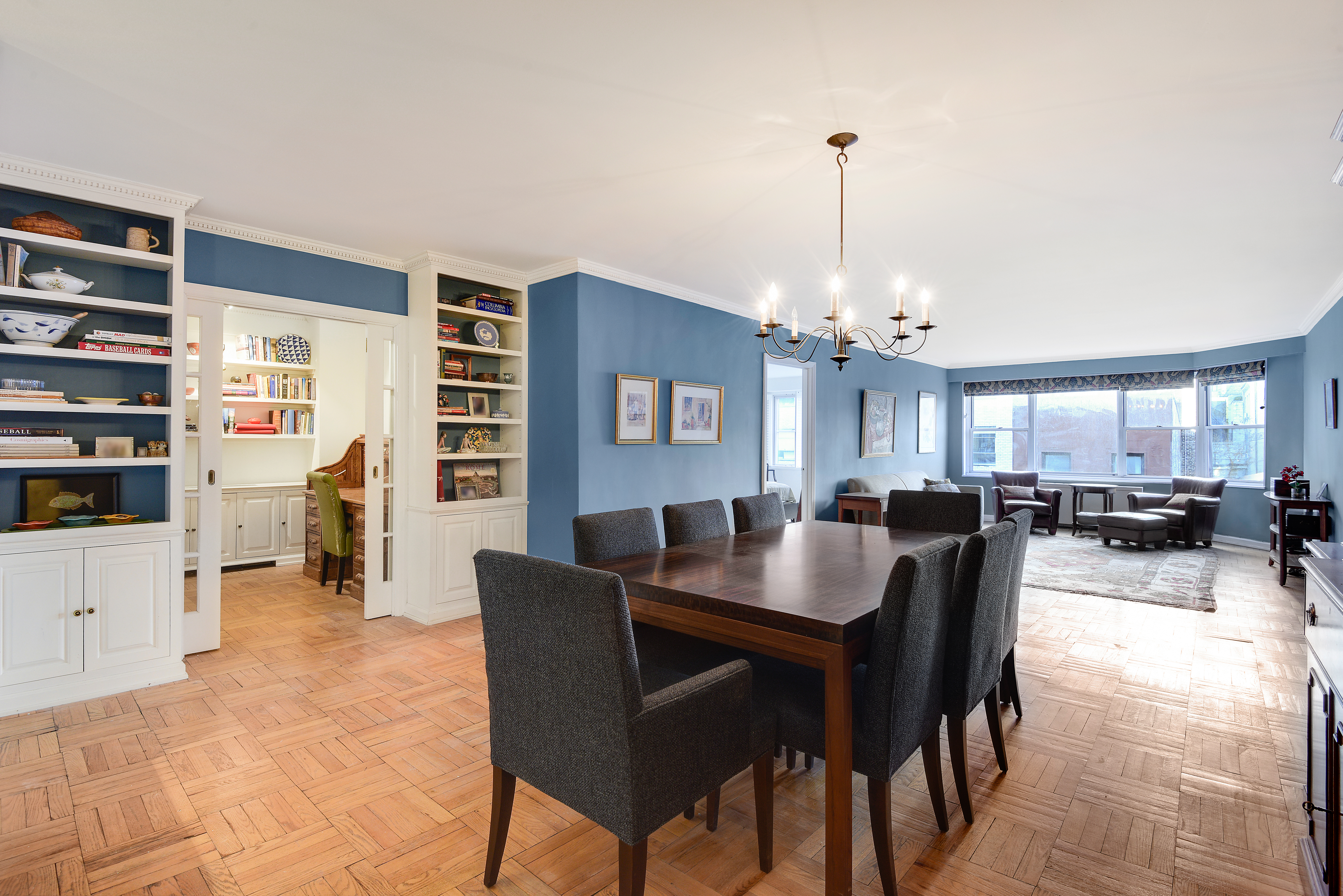 150 East 61st Street, Unit 5C Manhattan, NY 10065 - Photo 1 of 18 a dining room with furniture and window