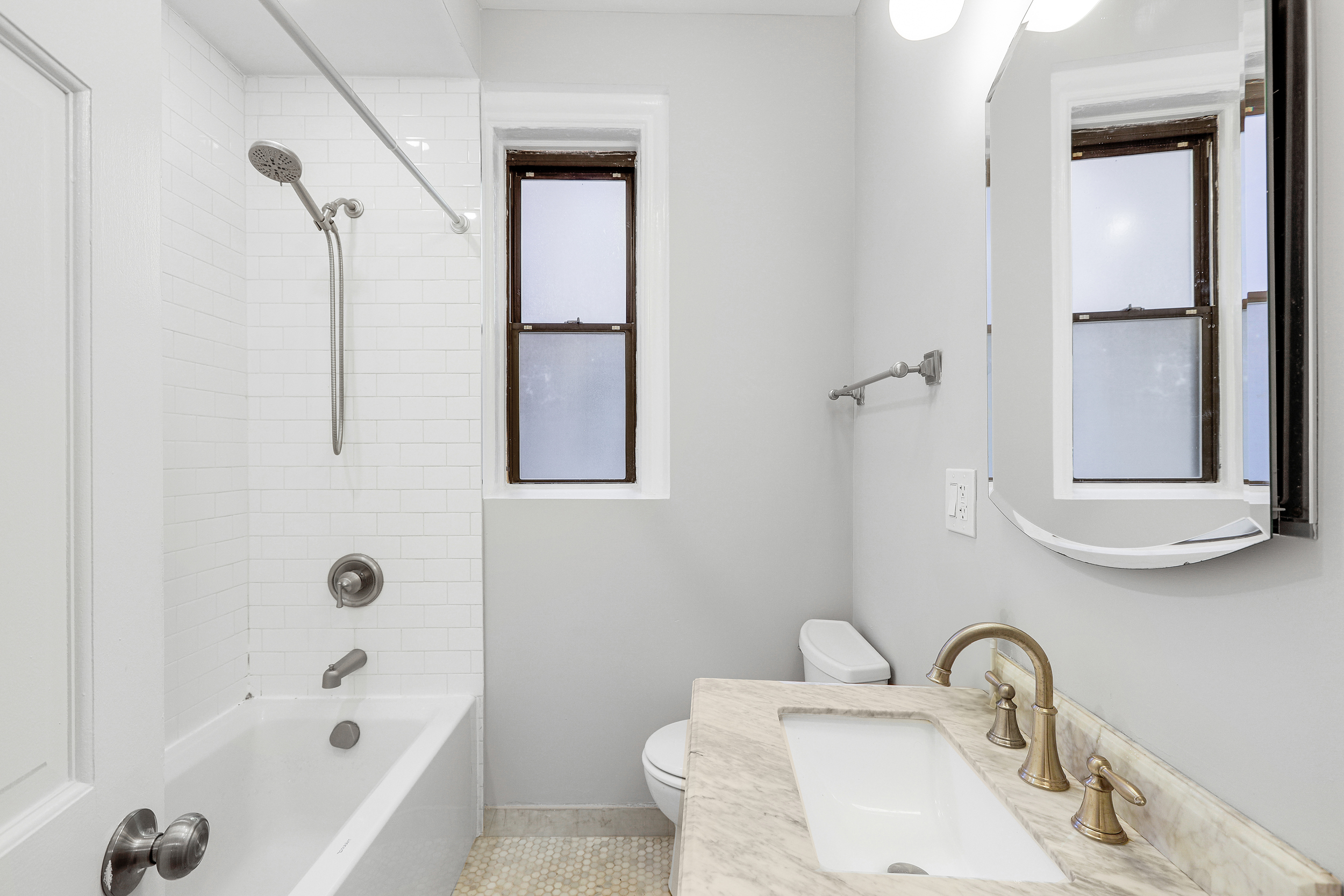 175 Prospect Park Southwest, Unit 1C Brooklyn, NY 11218 - Photo 9 of 12 a bathroom with a sink and a bathtub