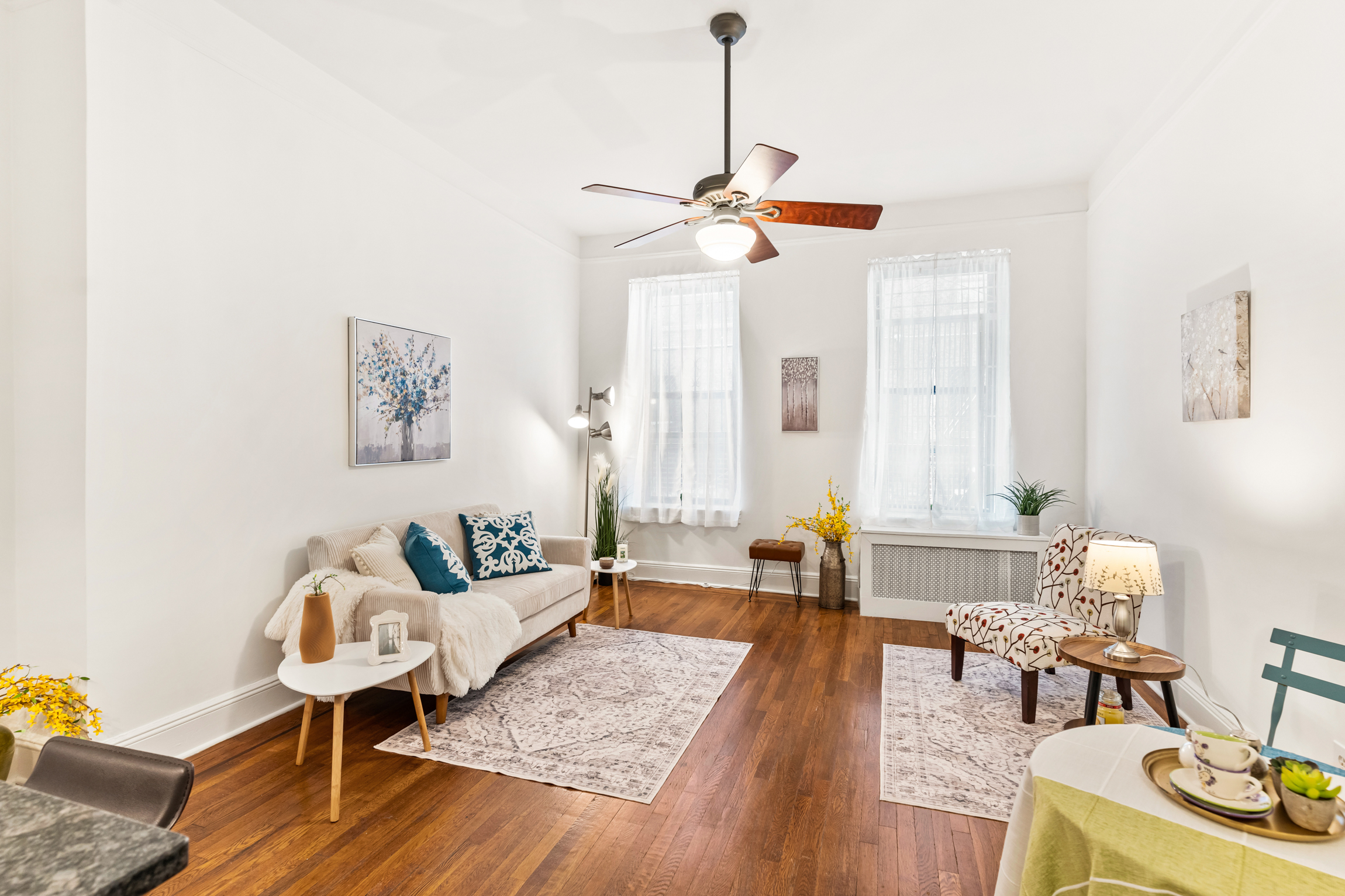 26 West 97th Street, Unit 1D Manhattan, NY 10025 - Photo 1 of 11 a living room with furniture and a wooden floor