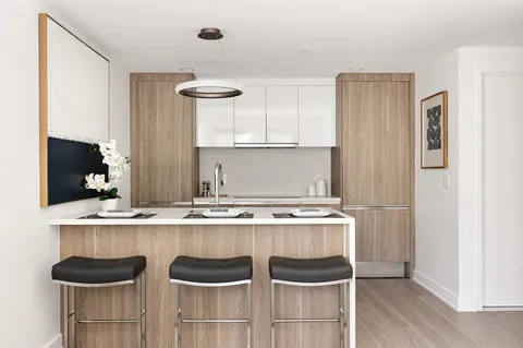 a kitchen with a table and chairs