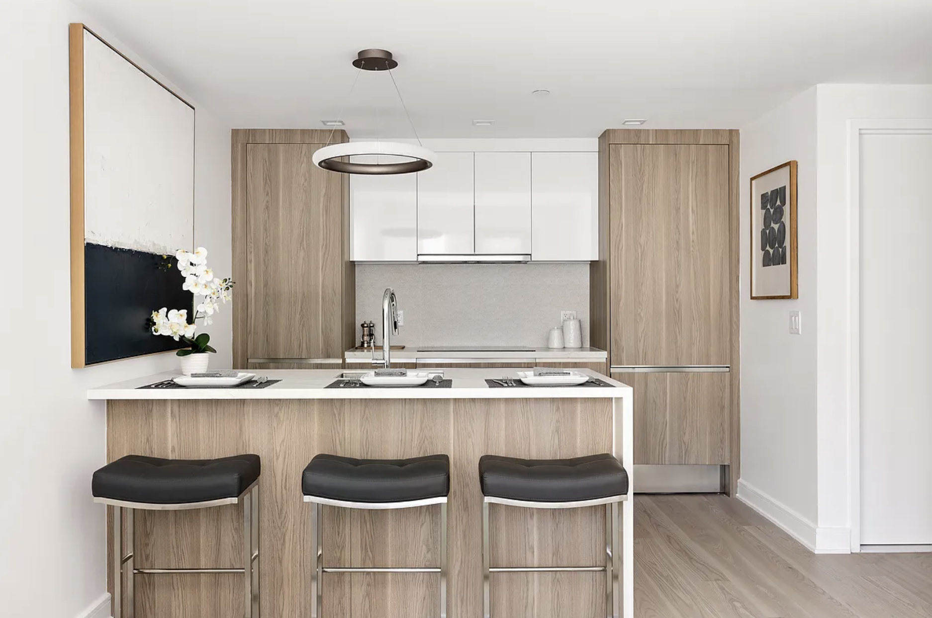 27-09 40th Avenue, Unit 3I Queens, NY 11101 - Photo 2 of 13 a kitchen with a table and chairs