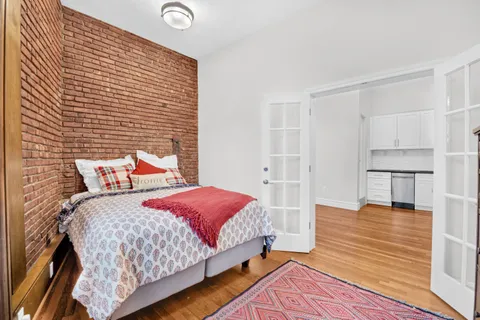 a bedroom with a bed and a table