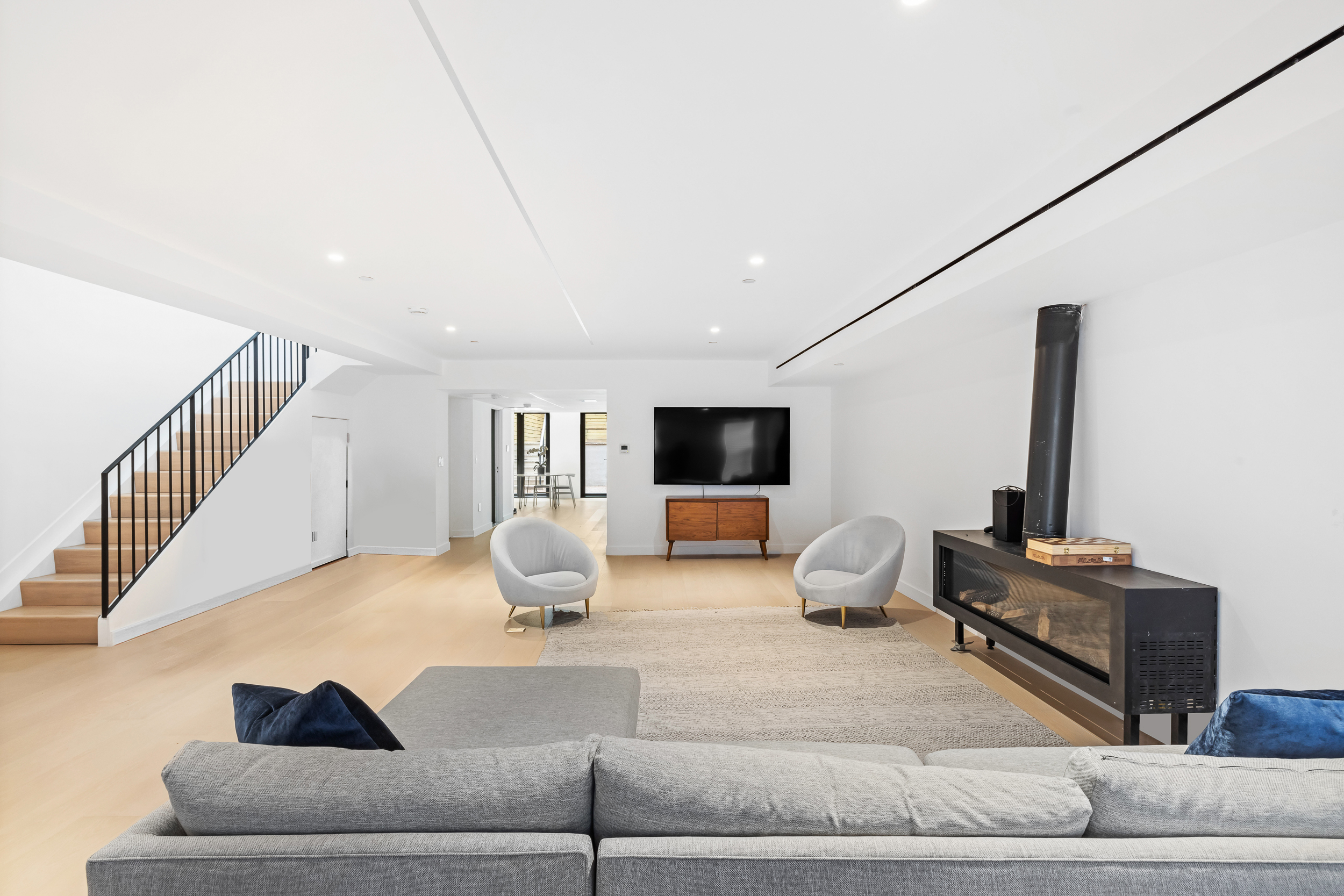 442 West 22nd Street Manhattan, NY 10011 - Photo 2 of 17 a living room with furniture