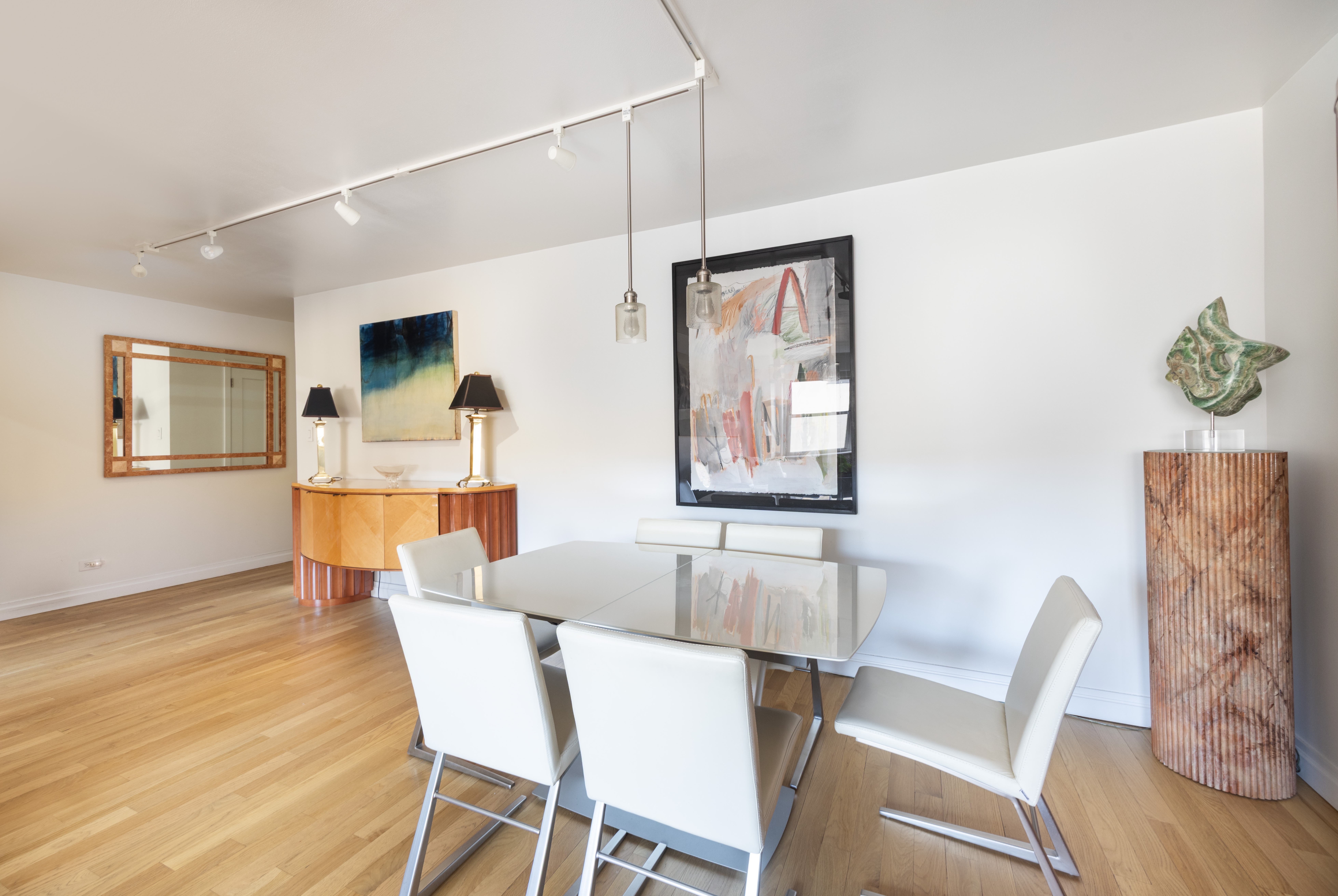 50 East 79th Street, Unit 7B Manhattan, NY 10075 - Photo 3 of 15 a dining room with furniture and wooden floor