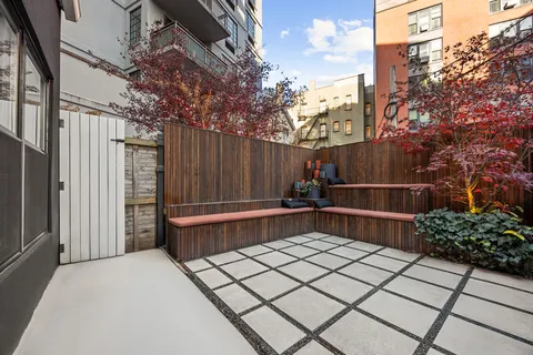 a bathroom with a toilet a sink and bathtub