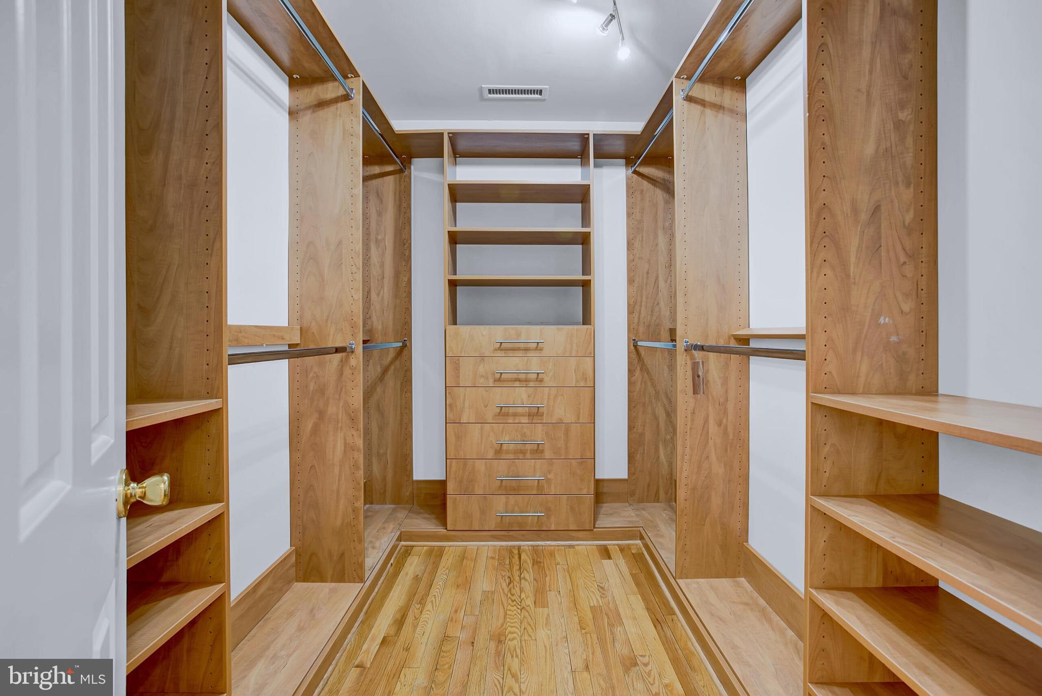 4709 Foxhall Crescent Northwest Washington, DC 20007 - Photo 33 of 57 a view of walk in closet with empty racks