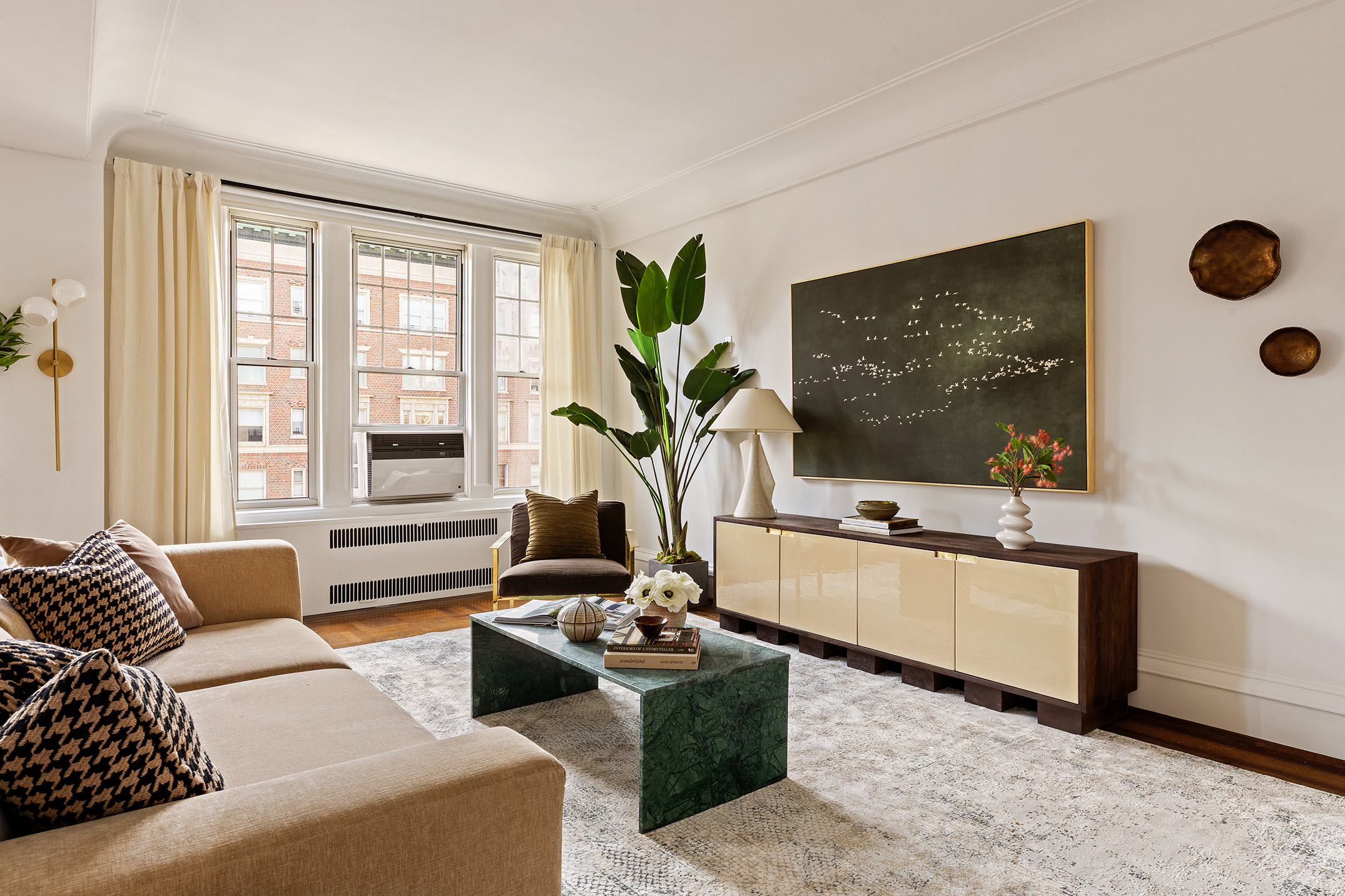 875 Park Avenue, Unit 11C Manhattan, NY 10075 - Photo 5 of 25 a living room with furniture and a flat screen tv