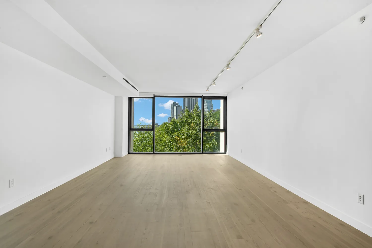 a view of a livingroom with furniture and staircase
