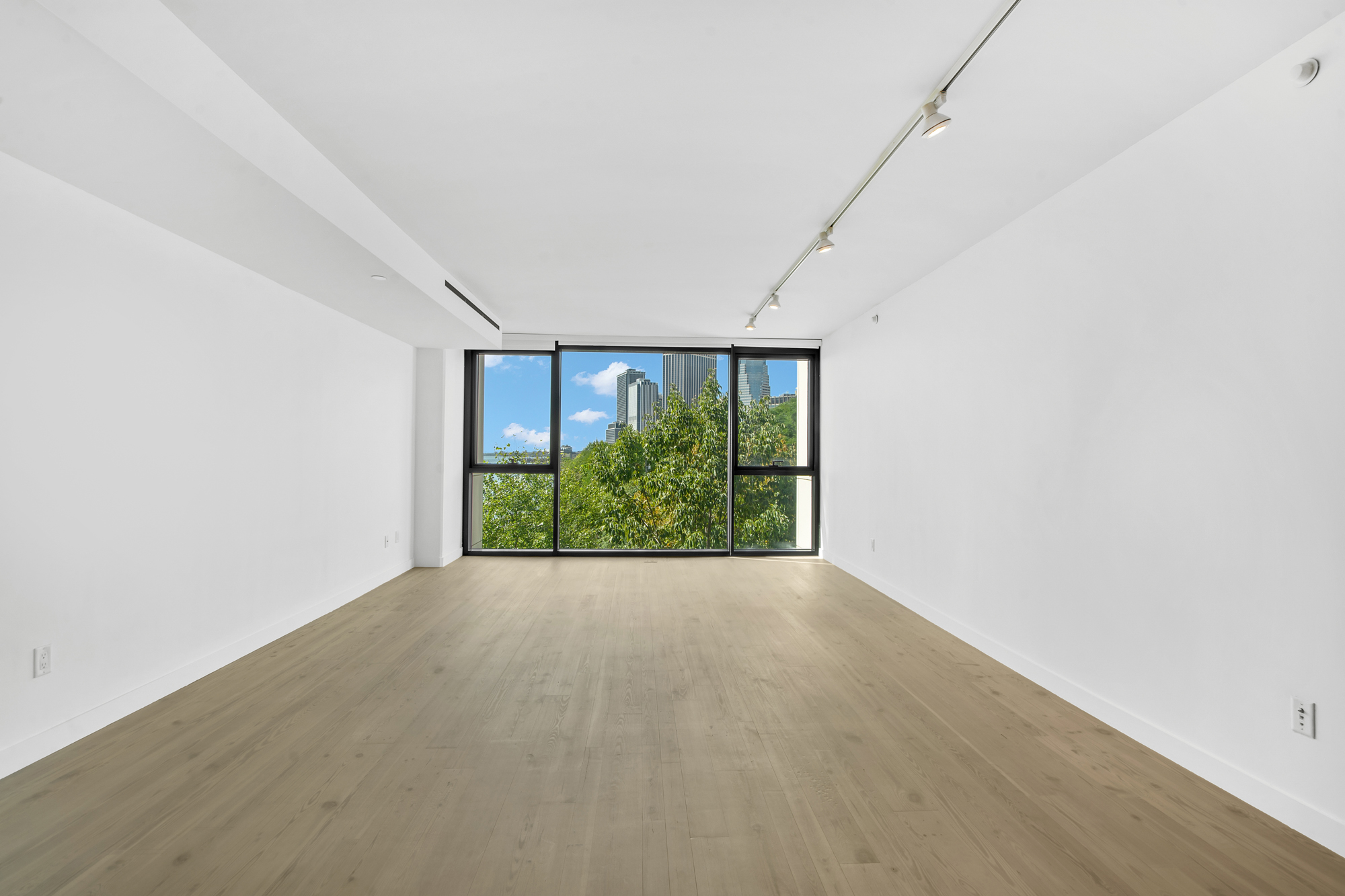 90 Furman Street, Unit N405 Brooklyn, NY 11201 - Photo 21 of 36 a view of an empty room with a window