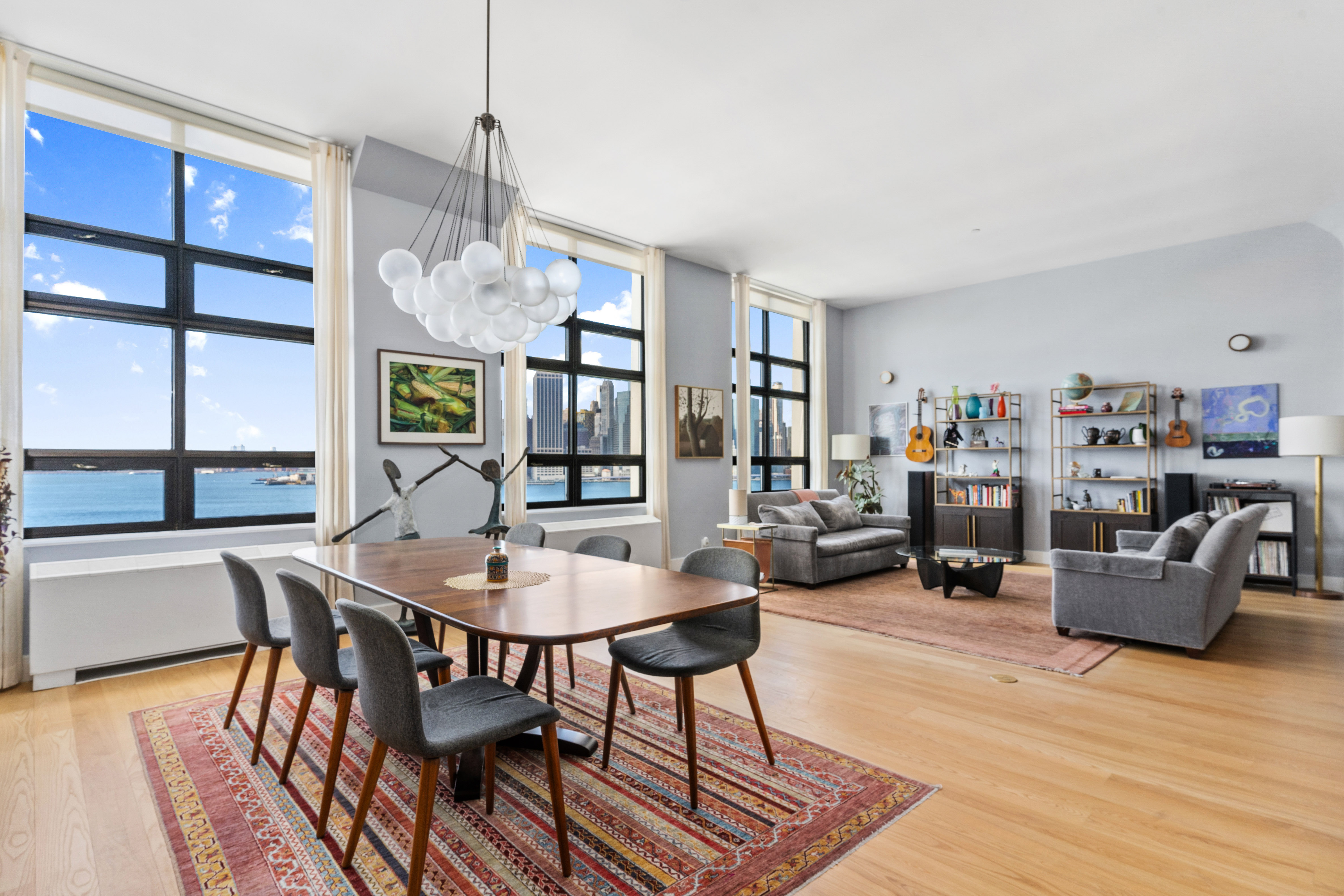 360 Furman Street, Unit 734 Brooklyn, NY 11201 - Photo 1 of 31 a dining room with furniture a chandelier and wooden floor