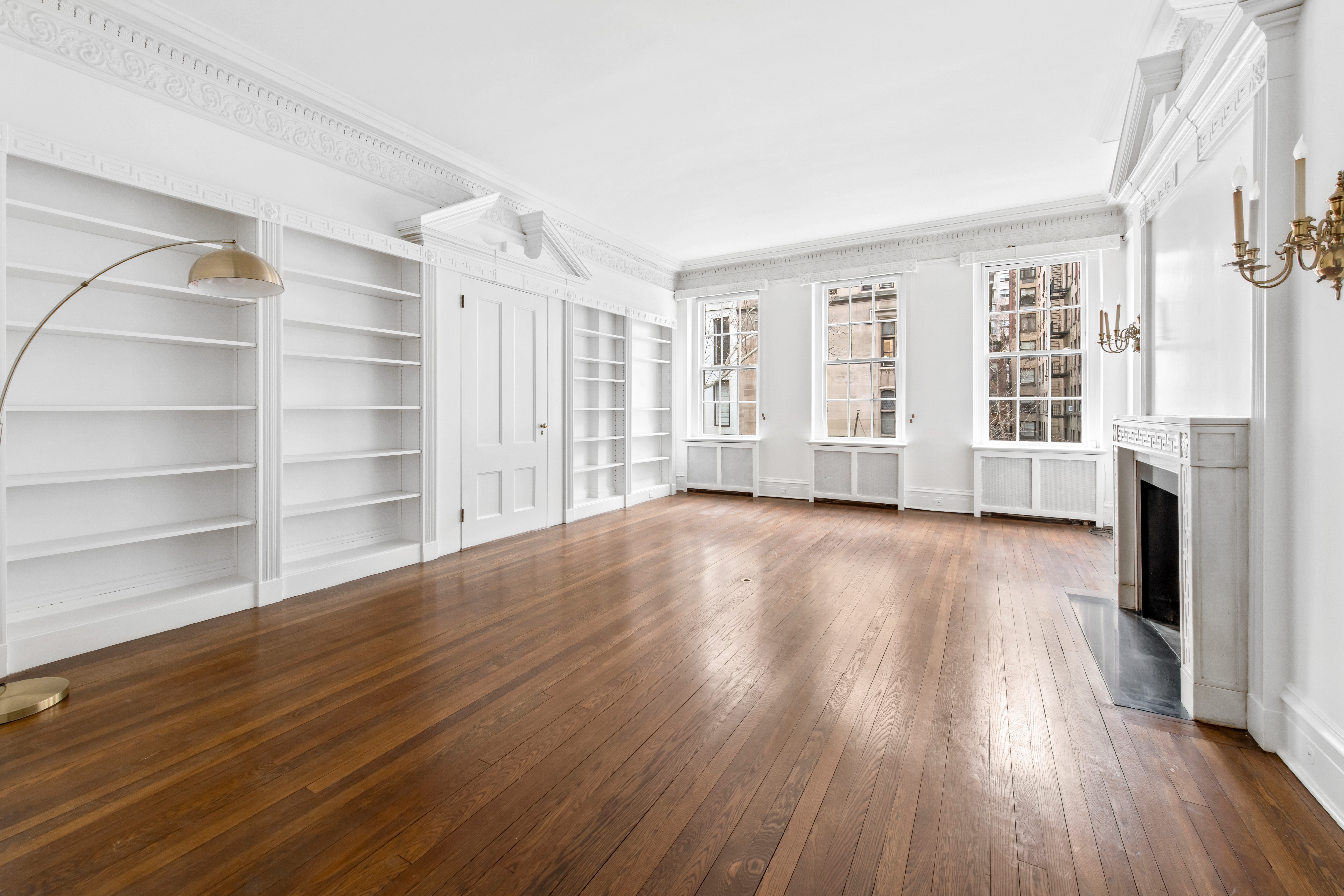 155 East 70th Street Manhattan, NY 10021 - Photo 11 of 27 wooden floor in an empty room with a window
