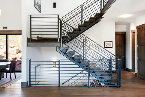 a bathroom with a bathtub and next to a window
