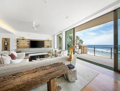 a bedroom with furniture and a flat screen tv