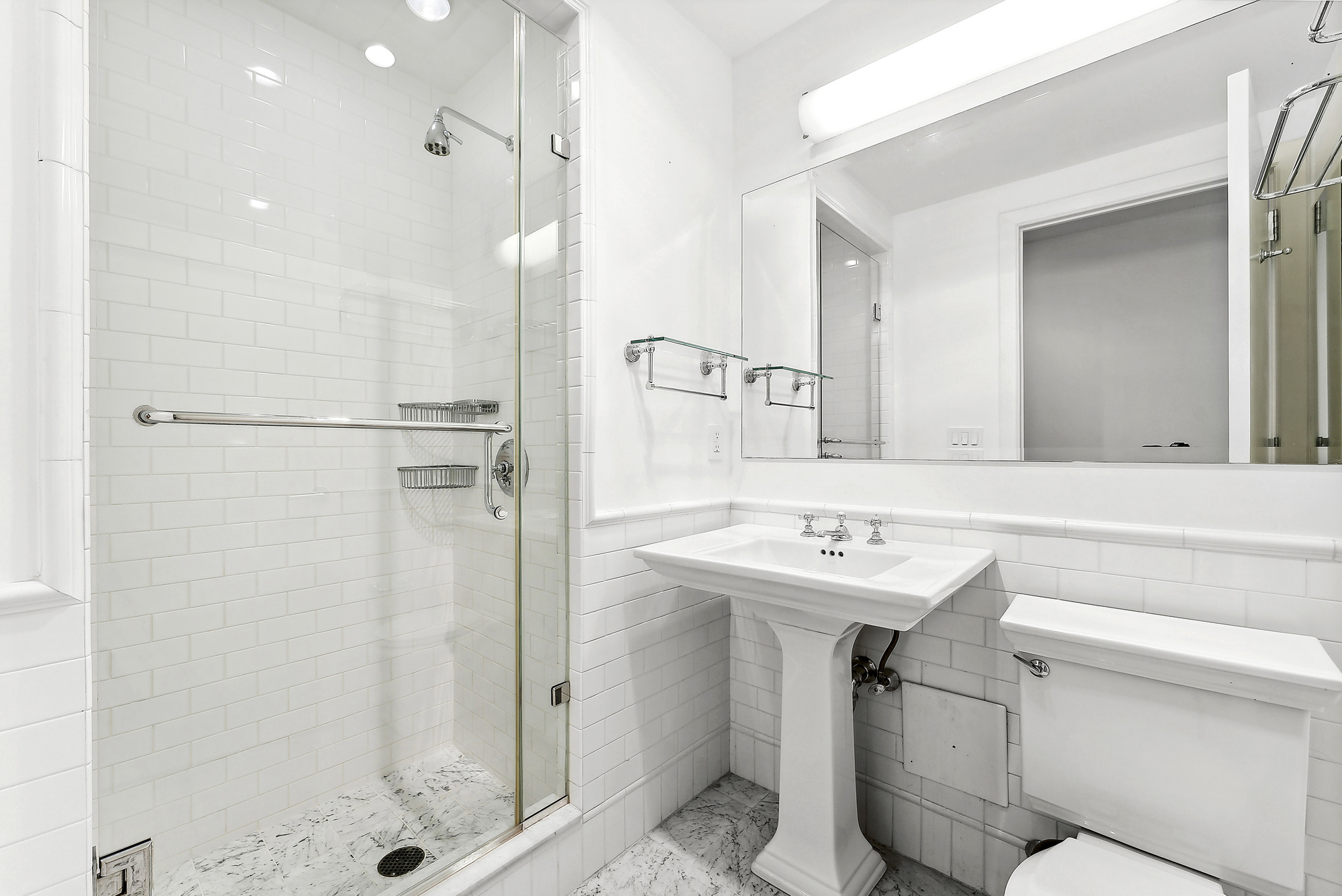 43 West 64th Street, Unit 4D Manhattan, NY 10023 - Photo 8 of 11 a bathroom with a sink toilet and shower