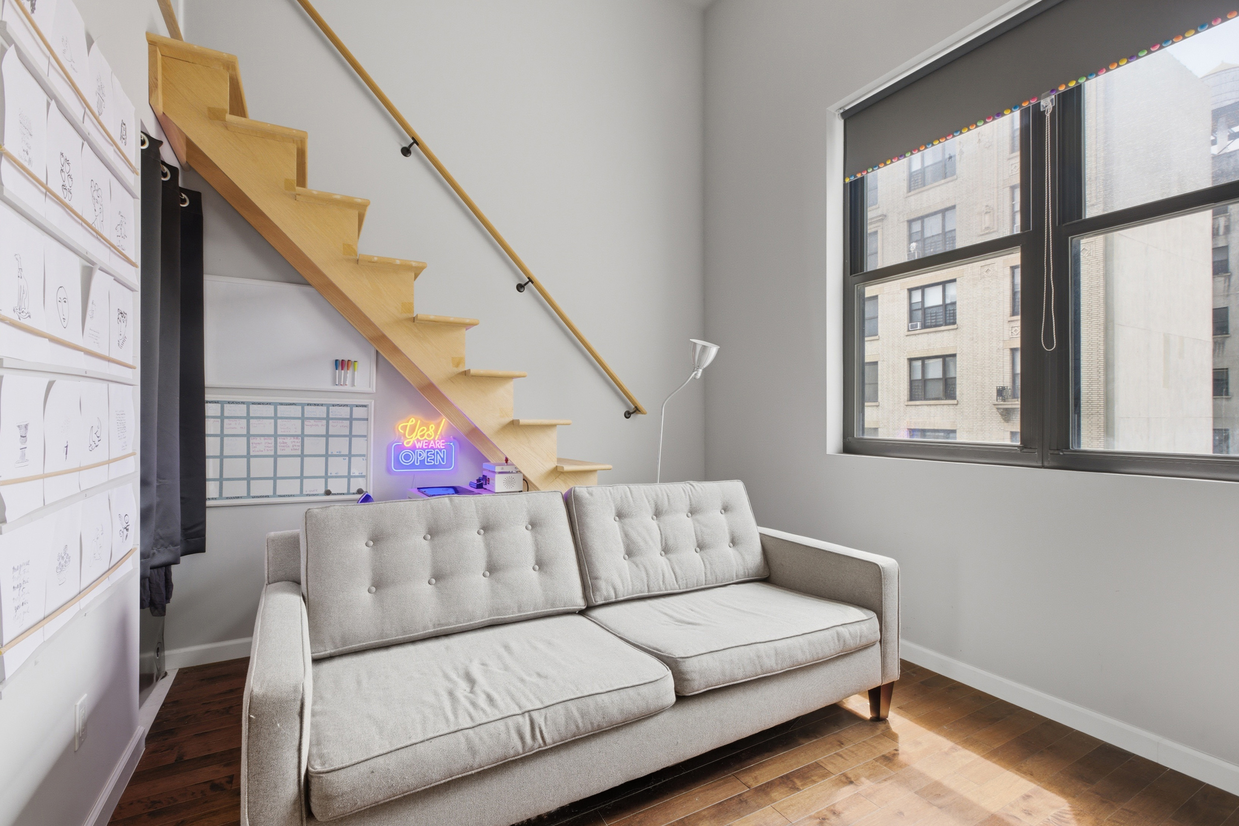 127 West 123rd Street Manhattan, NY 10027 - Photo 22 of 28 a living room with furniture and a large window