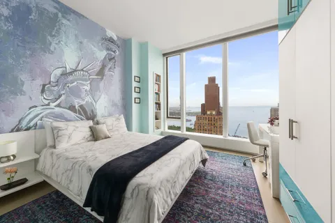 a bathroom with a tub a sink and a shower