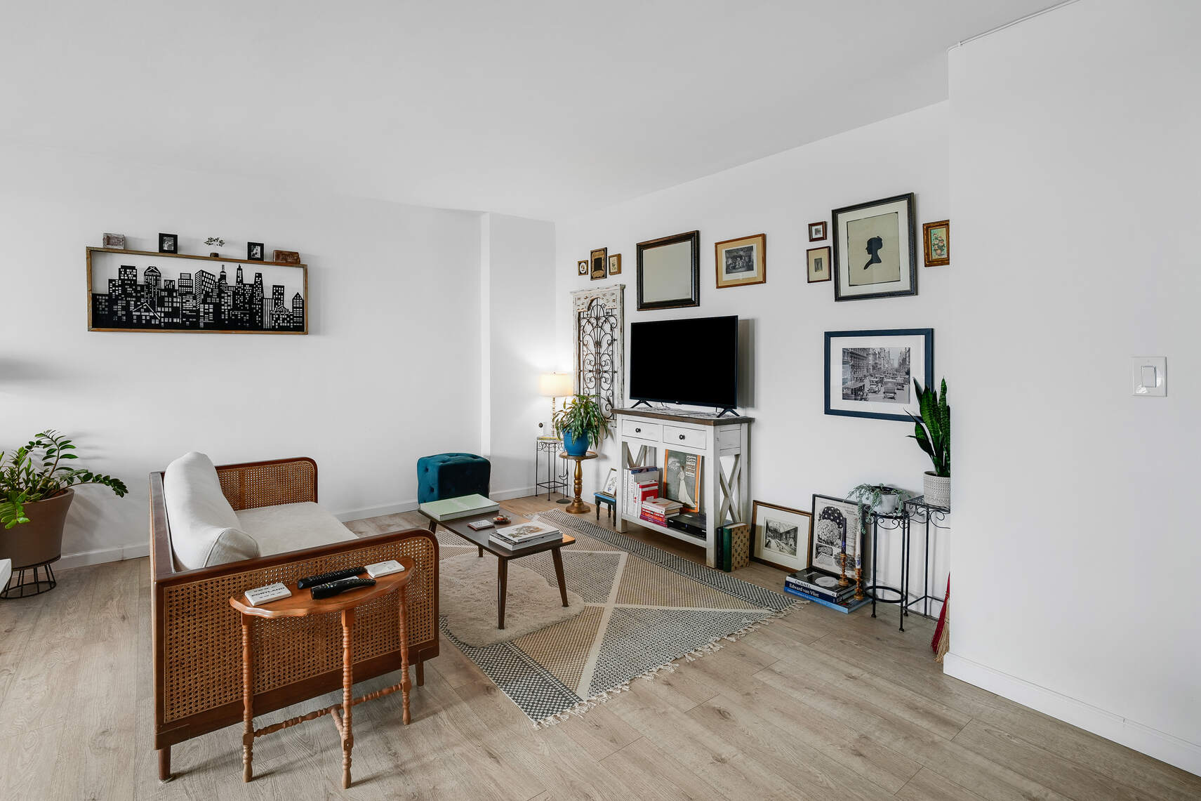 5800 Arlington Avenue, Unit 17D Bronx, NY 10471 - Photo 5 of 14 a living room with furniture and a flat screen tv