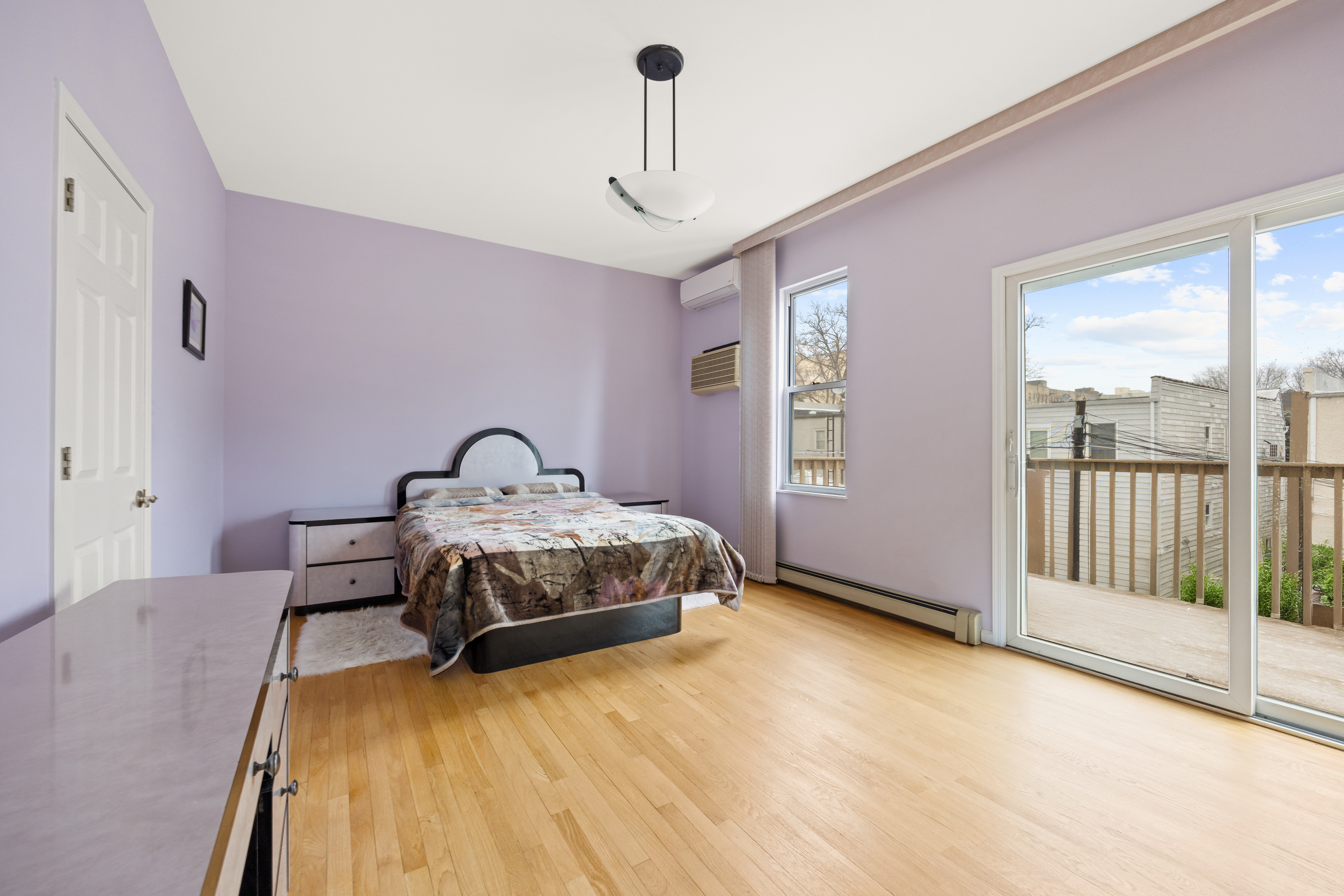 1635 West 12th Street Brooklyn, NY 11223 - Photo 6 of 21 a bedroom with a bed and a window