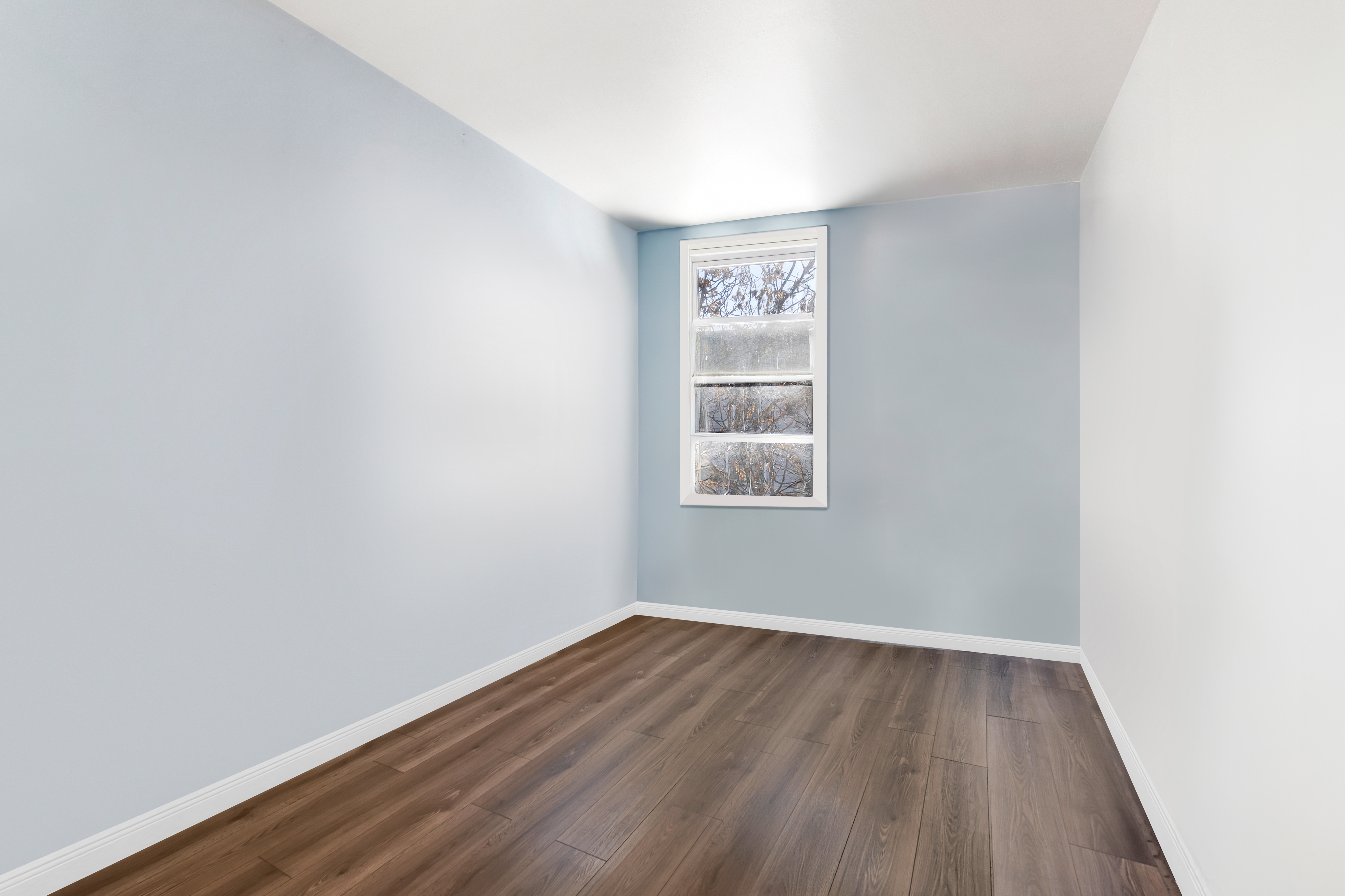 364 Chauncey Street Brooklyn, NY 11233 - Photo 9 of 17 a view of an empty room with wooden floor and a window