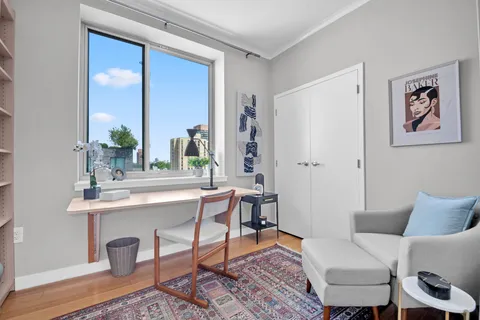 a view of a livingroom with furniture and a window