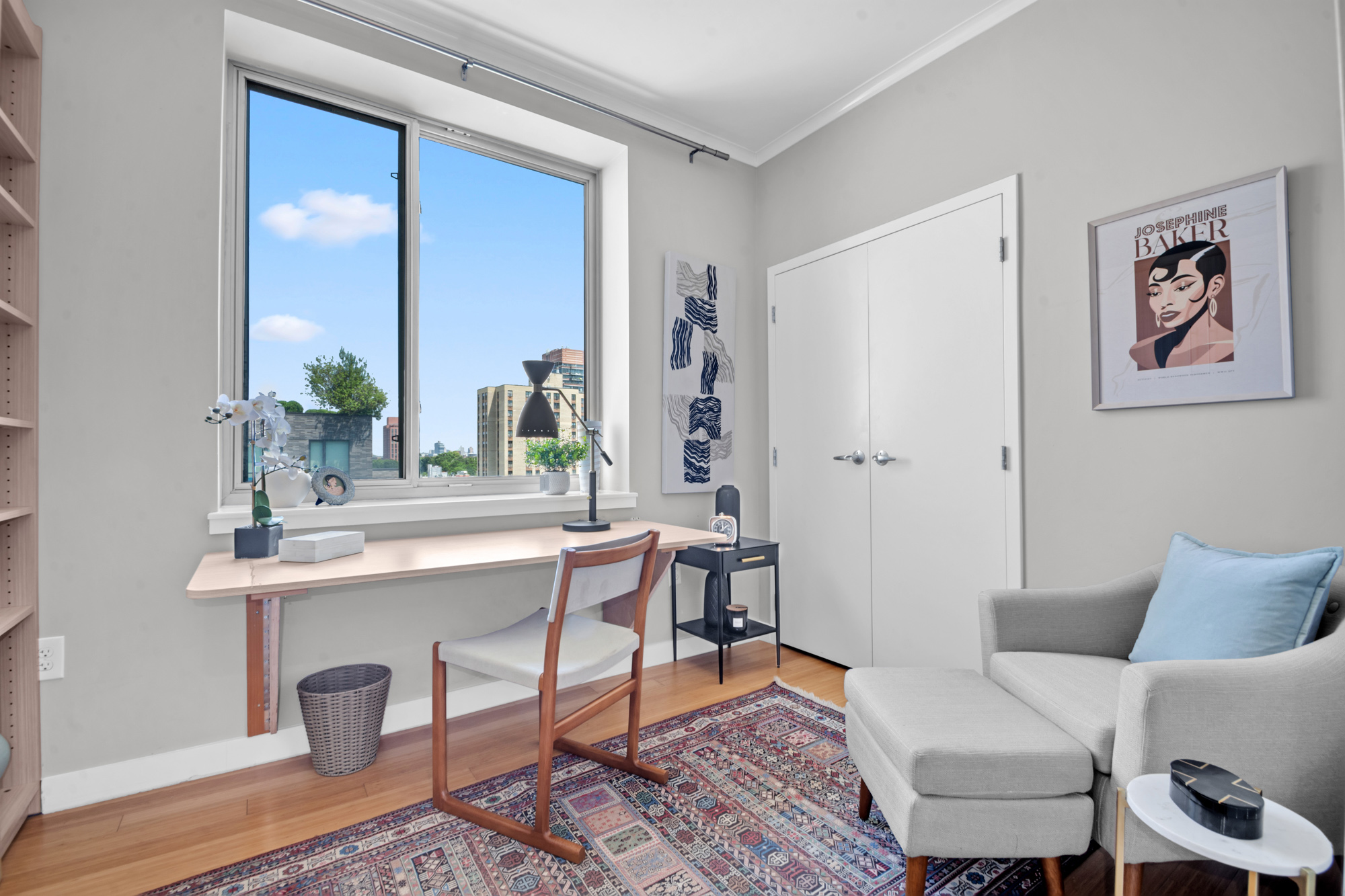 40 West 116th Street, Unit PHA1208 Manhattan, NY 10026 - Photo 10 of 28 a view of a livingroom with furniture and a window