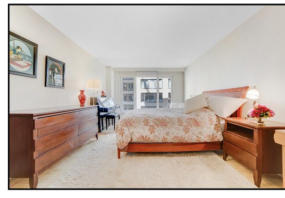 200 Central Park South, Unit 7Q Manhattan, NY 10019 - Photo 5 of 6 a bedroom with a bed and a window