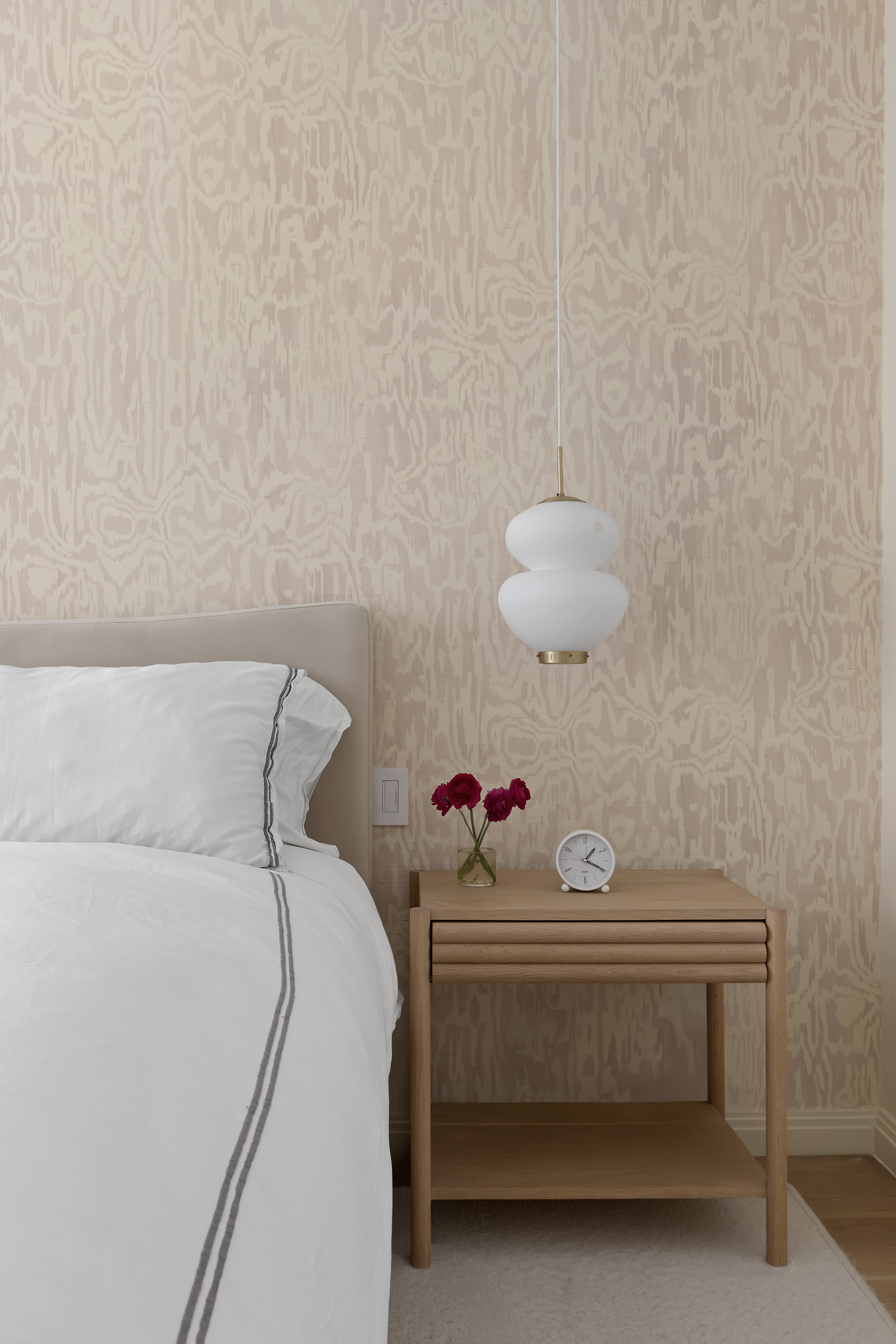 9 College Place, Unit 2K Brooklyn, NY 11201 - Photo 9 of 17 a bedroom with a bed and a chandelier