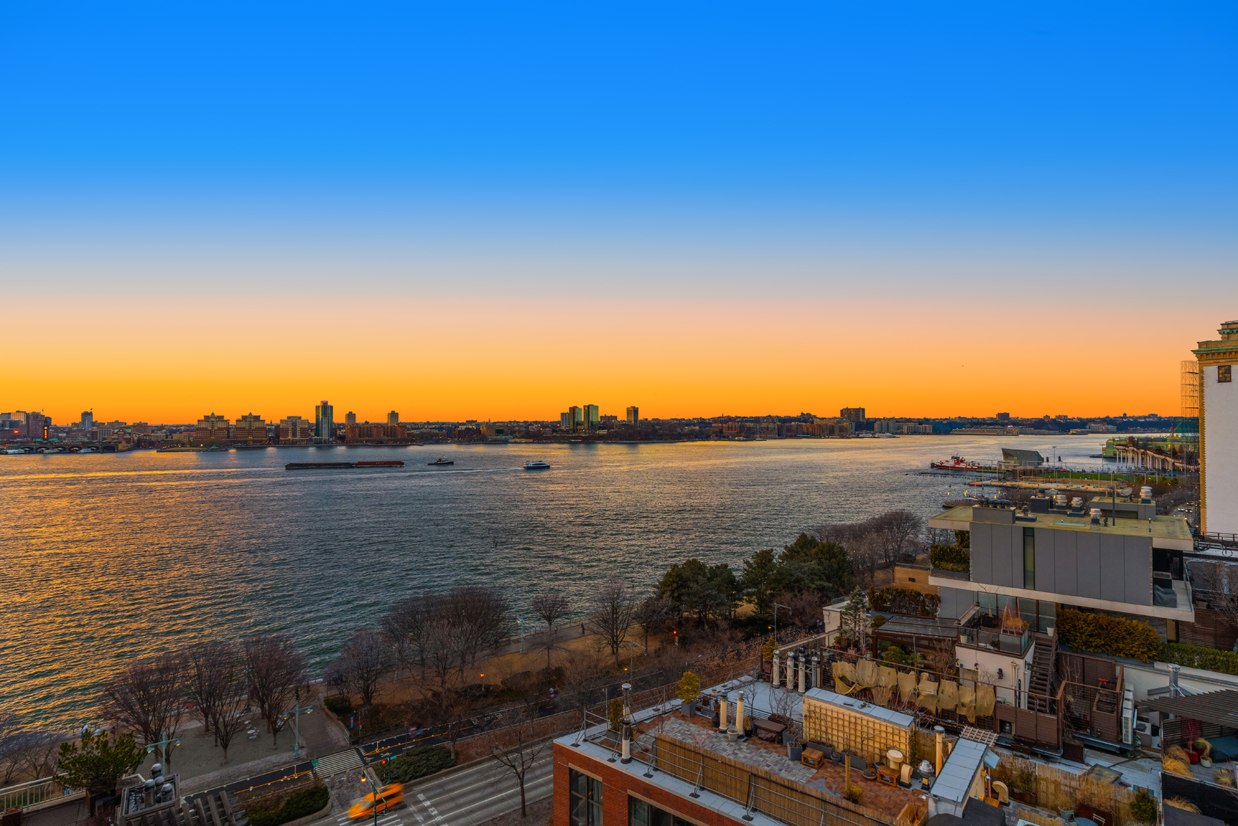 366 West 11th Street, Unit PHF Manhattan, NY 10014 - Photo 6 of 28 a view of a lake with table and chairs