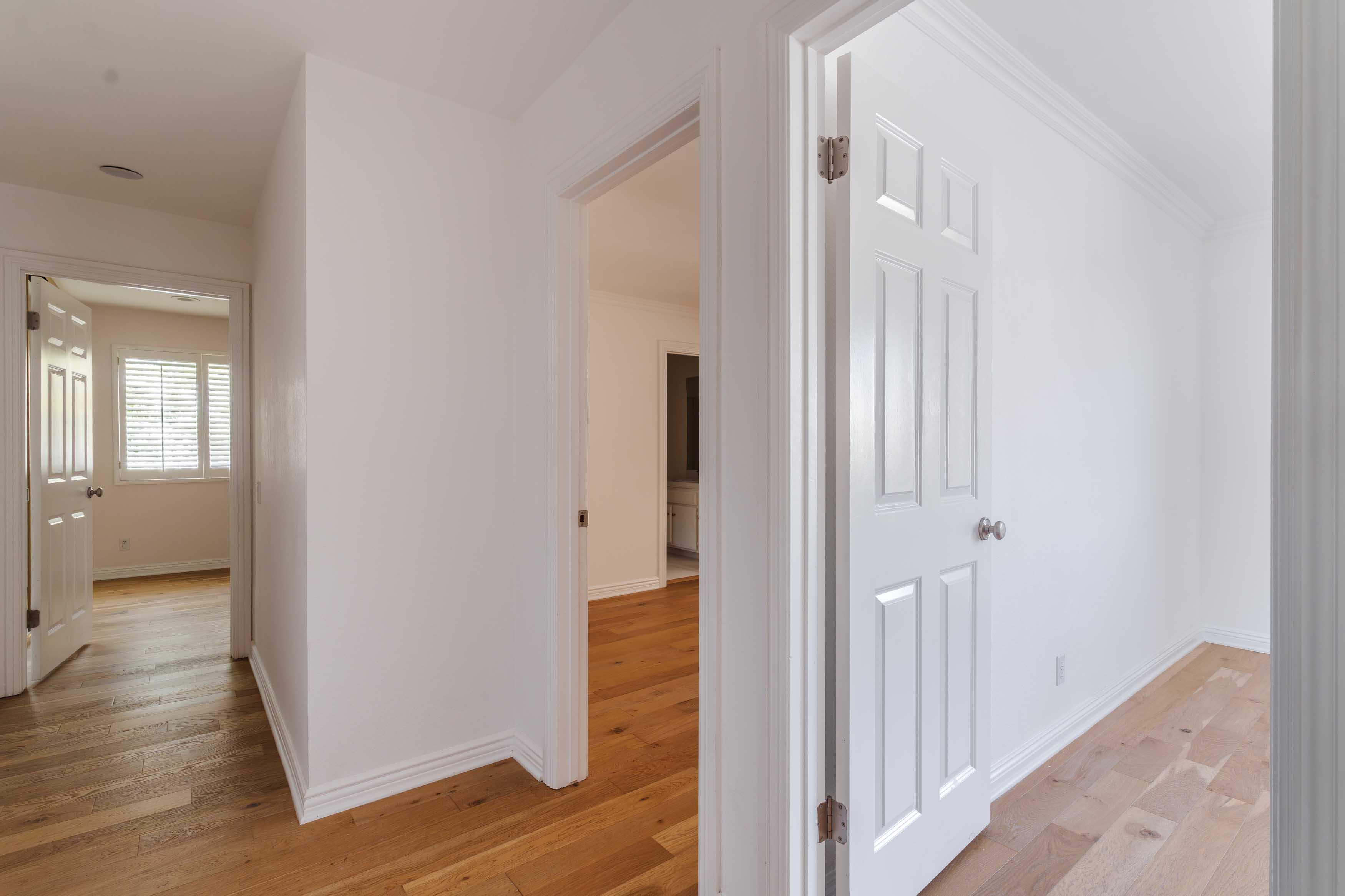 17273 Avenida De La Herradura Pacific Palisades, CA 90272 - Photo 21 of 23 a view of a hallway with wooden floor and closet