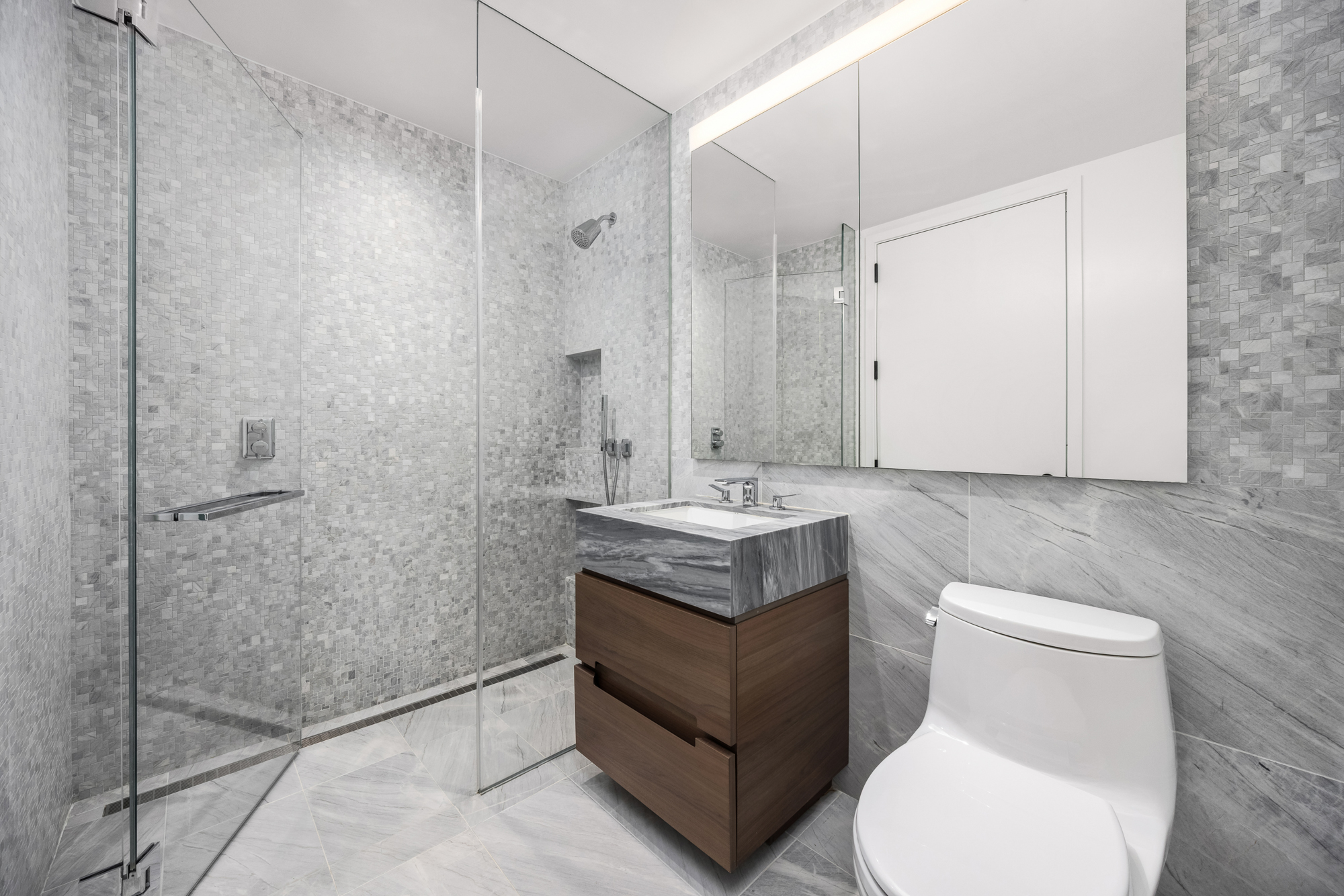 30 Riverside Boulevard, Unit 29B Manhattan, NY 10069 - Photo 15 of 20 a bathroom with a sink a toilet and shower