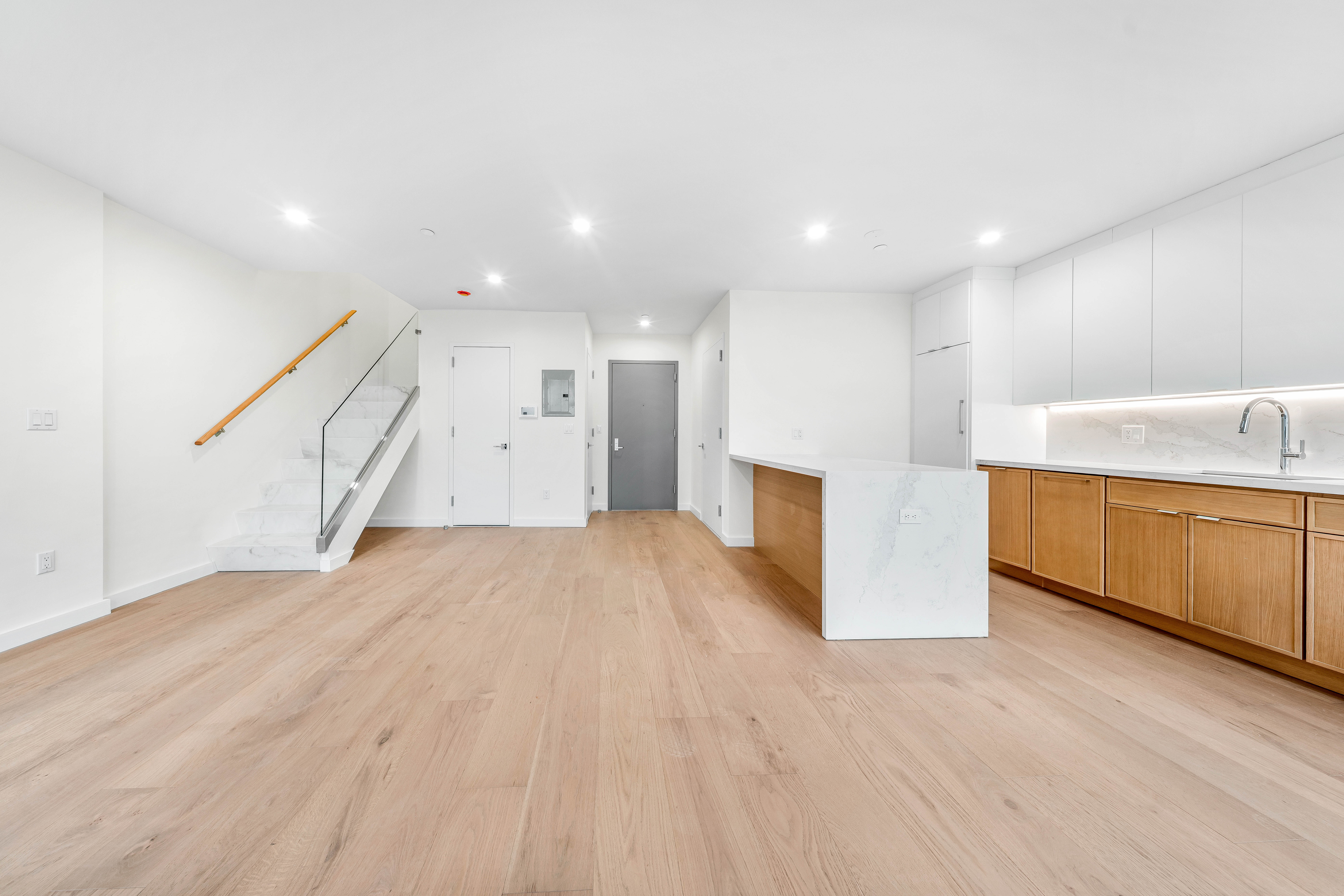 30-24 32nd Street, Unit 4A Queens, NY 11102 - Photo 16 of 22 a view of an empty room and wooden floor