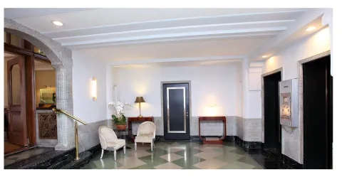 a living room with furniture and a dining table