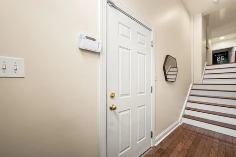 a view of entryway with wooden floor