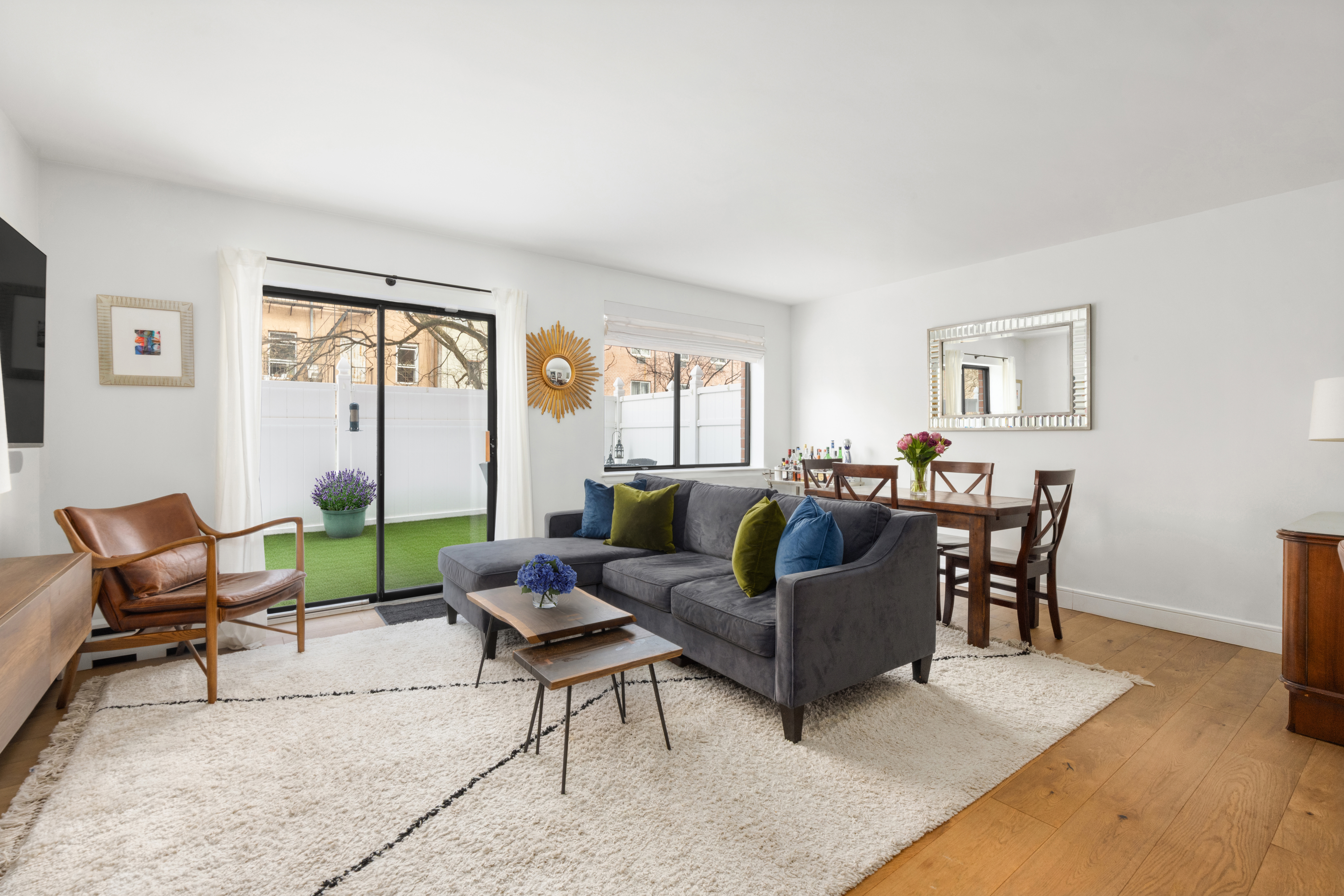 333 East 119th Street, Unit 1H Manhattan, NY 10035 - Photo 5 of 17 a living room with furniture and a window