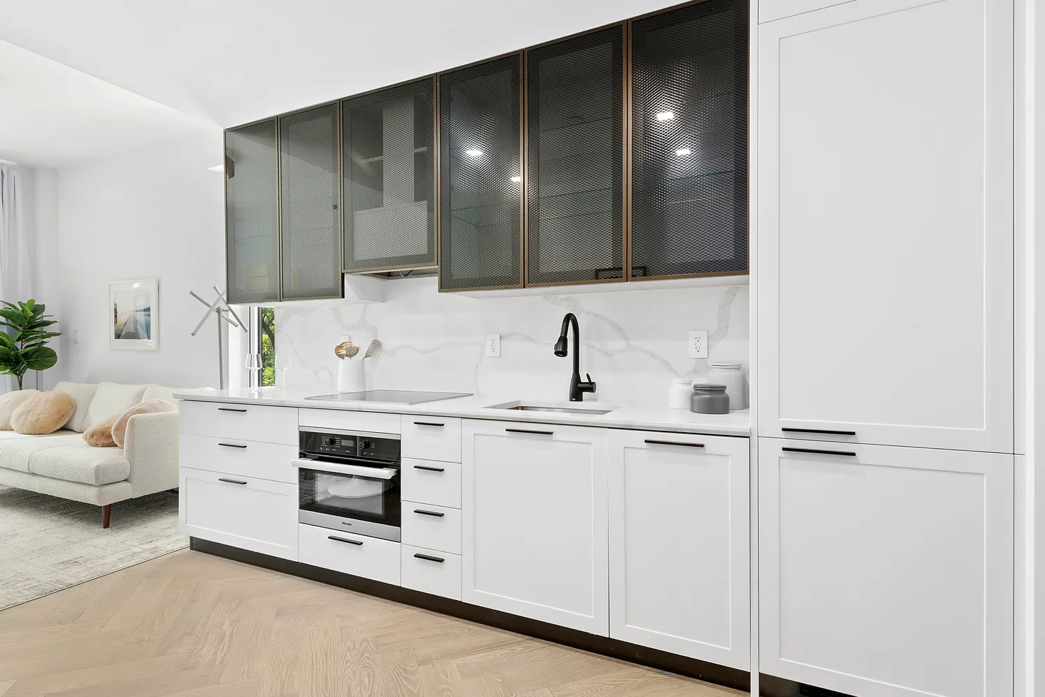 a kitchen with white cabinets and white appliances
