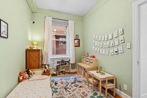 a bathroom with a sink a toilet a shower and a mirror