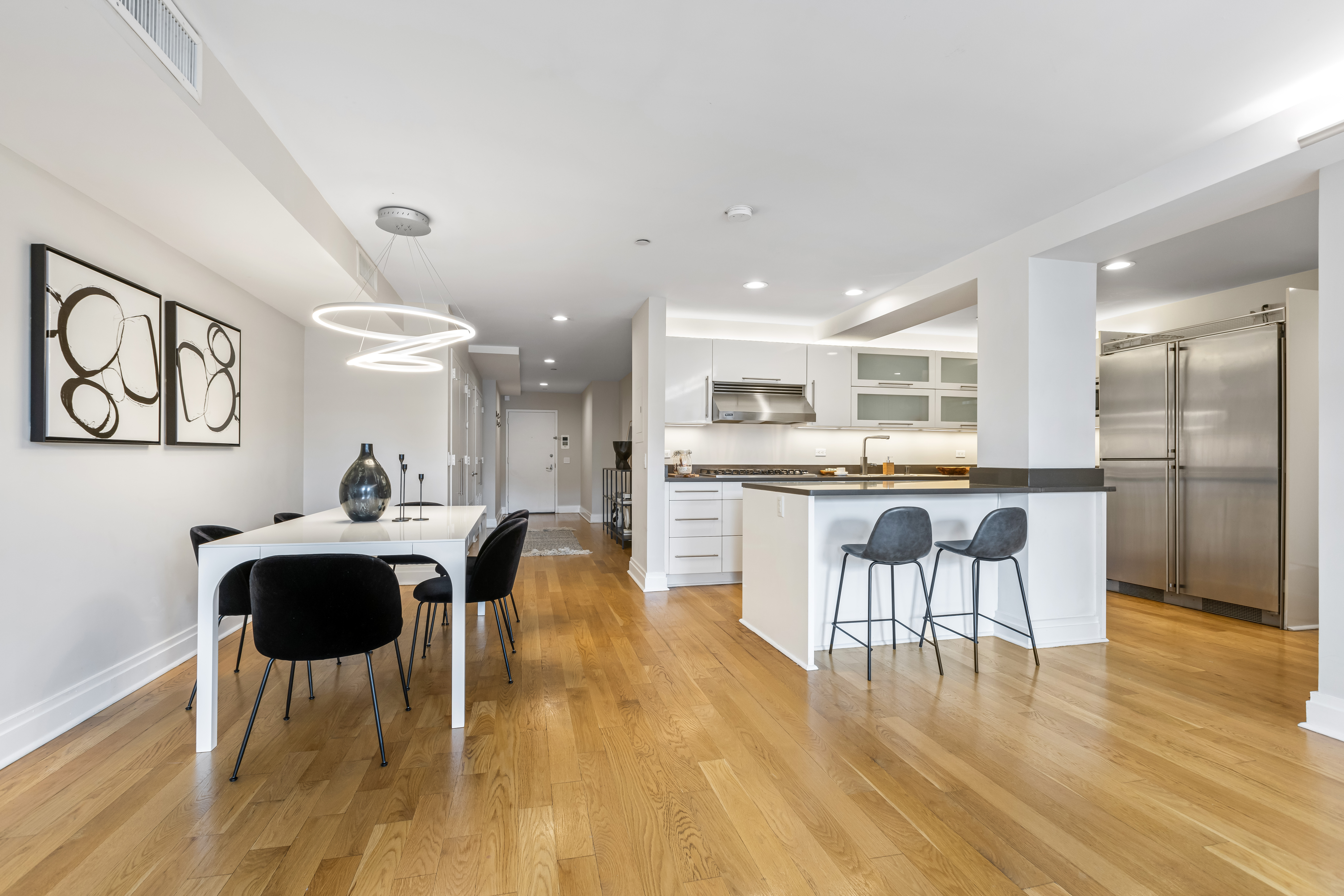 257 West 117th Street, Unit 6A Manhattan, NY 10026 - Photo 4 of 16 a view of a dining room with furniture and wooden floor