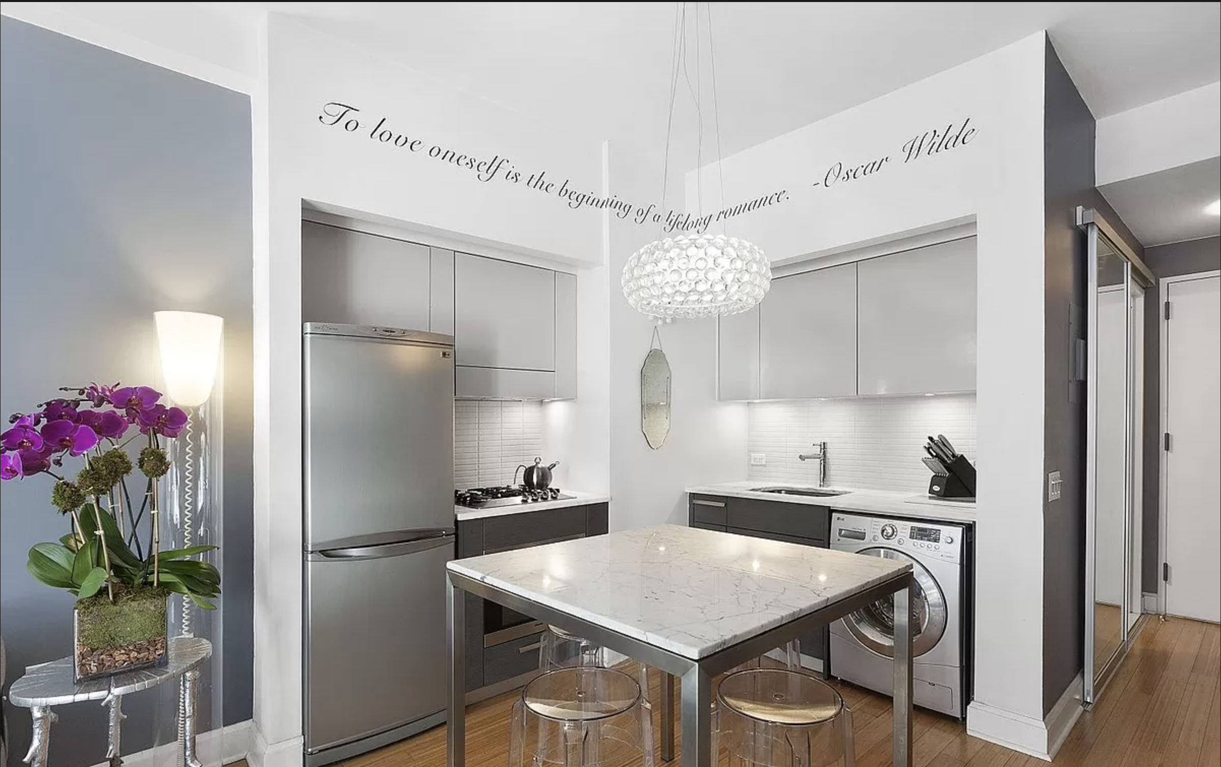 505 West 47th Street, Unit 1DS Manhattan, NY 10036 - Photo 2 of 8 a kitchen that has a refrigerator a stove a sink and a dining table