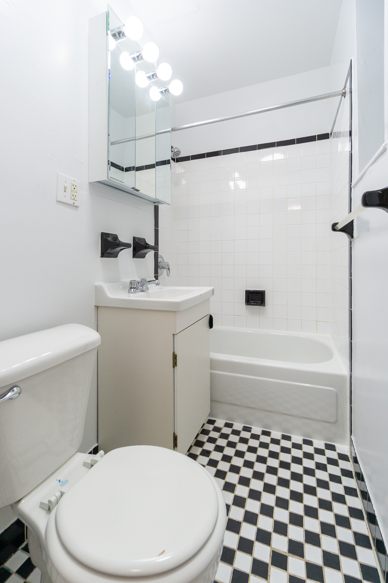 319 East 25th Street, Unit 1B Manhattan, NY 10010 - Photo 8 of 15 a bathroom with a sink a toilet and shower