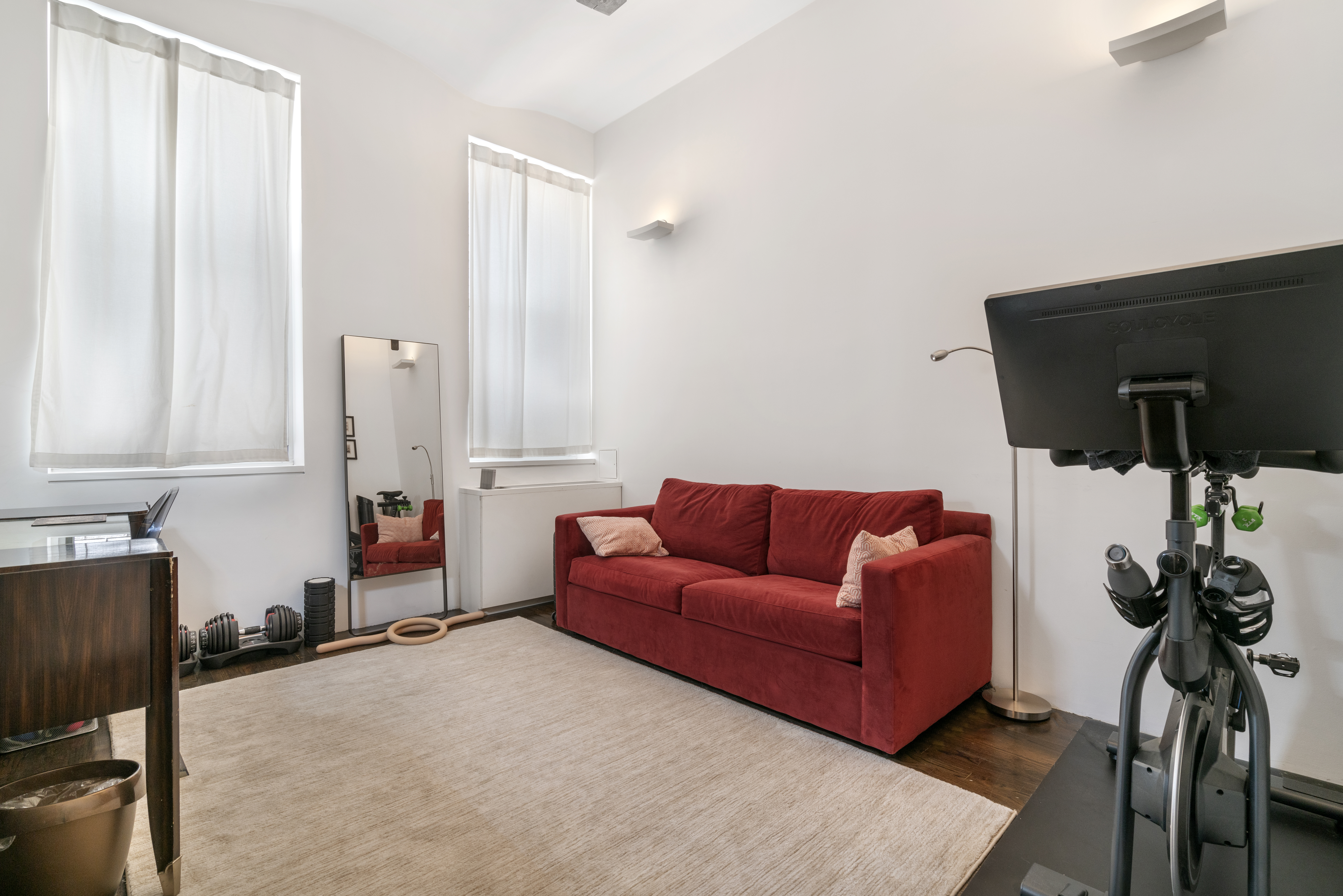 312 East 23rd Street, Unit 7B Manhattan, NY 10010 - Photo 7 of 14 a living room with furniture and a potted plant