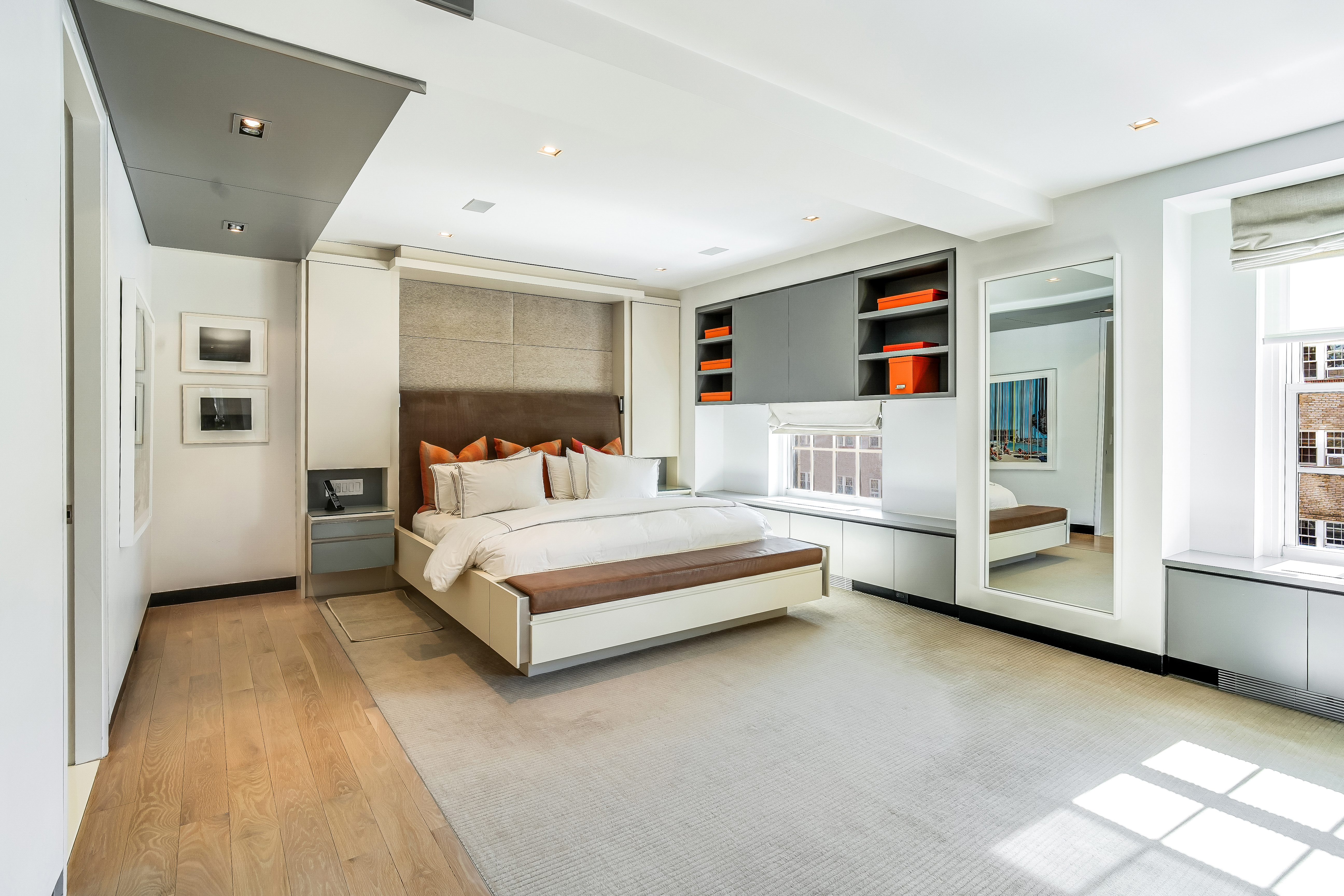 1 5th Avenue, Unit 5GH Manhattan, NY 10003 - Photo 14 of 26 a bedroom with a bed and a cabinets